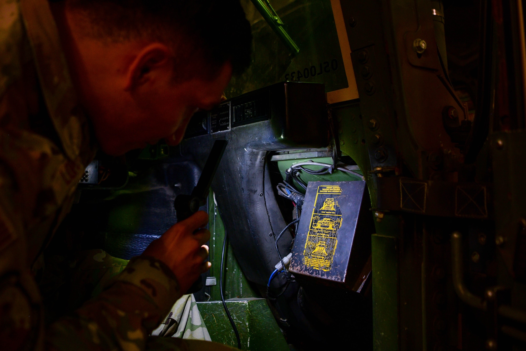 Airman 1st Class Miguel Lopez, 31st Logistics Readiness Squadron firetruck and refuelers maintainer, inspects a Humvee at Aviano Air Base, Italy, Oct. 20, 2022. The heavy and light duty maintenance section is a combination of two different career fields within vehicle maintenance, A-shreds and C-shreds, explained Owens. A-shreds work on fire trucks and refueling trucks, while C-shreds work on flightline equipment such as 60k aircraft cargo loaders along with light duty work. (U.S. Air Force photo by Senior Airman Brooke Moeder)