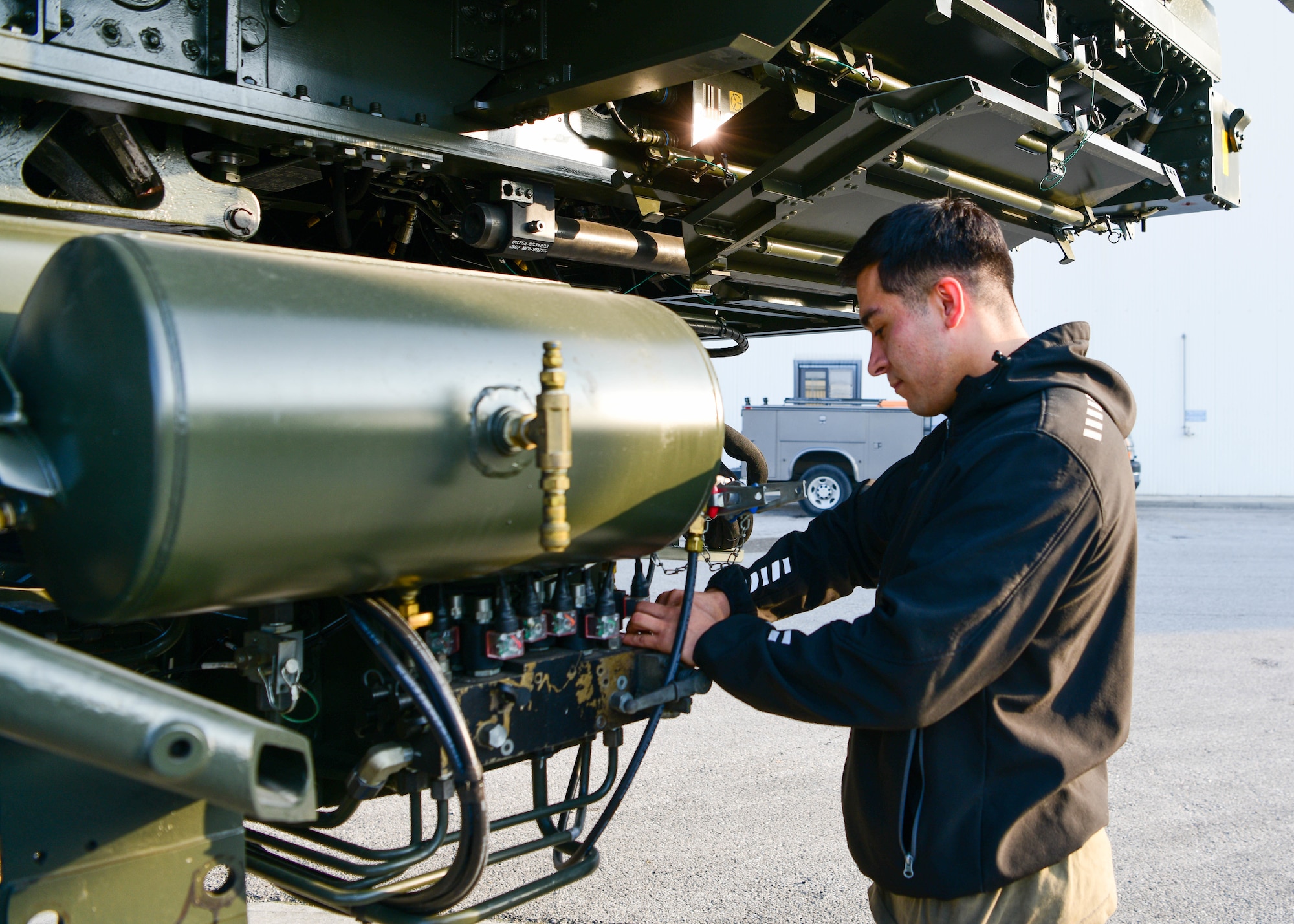 Senior Airman Armando Espinoza, 31st Logistics Readiness Squadron vehicle maintenance technician, inspects a Tunner 60k aircraft loader at Aviano Air Base, Italy, Oct. 20, 2022. The types of vehicles the 31st LRS Vehicle Maintenance team manages includes sedans, vans, trucks, bobtails, forklifts, Humvees, security forces patrol vehicles, 31st Civil Engineer Squadron heavy duty vehicles, busses, firetrucks, refueling trucks and more. (U.S. Air Force photo by Senior Airman Brooke Moeder)
