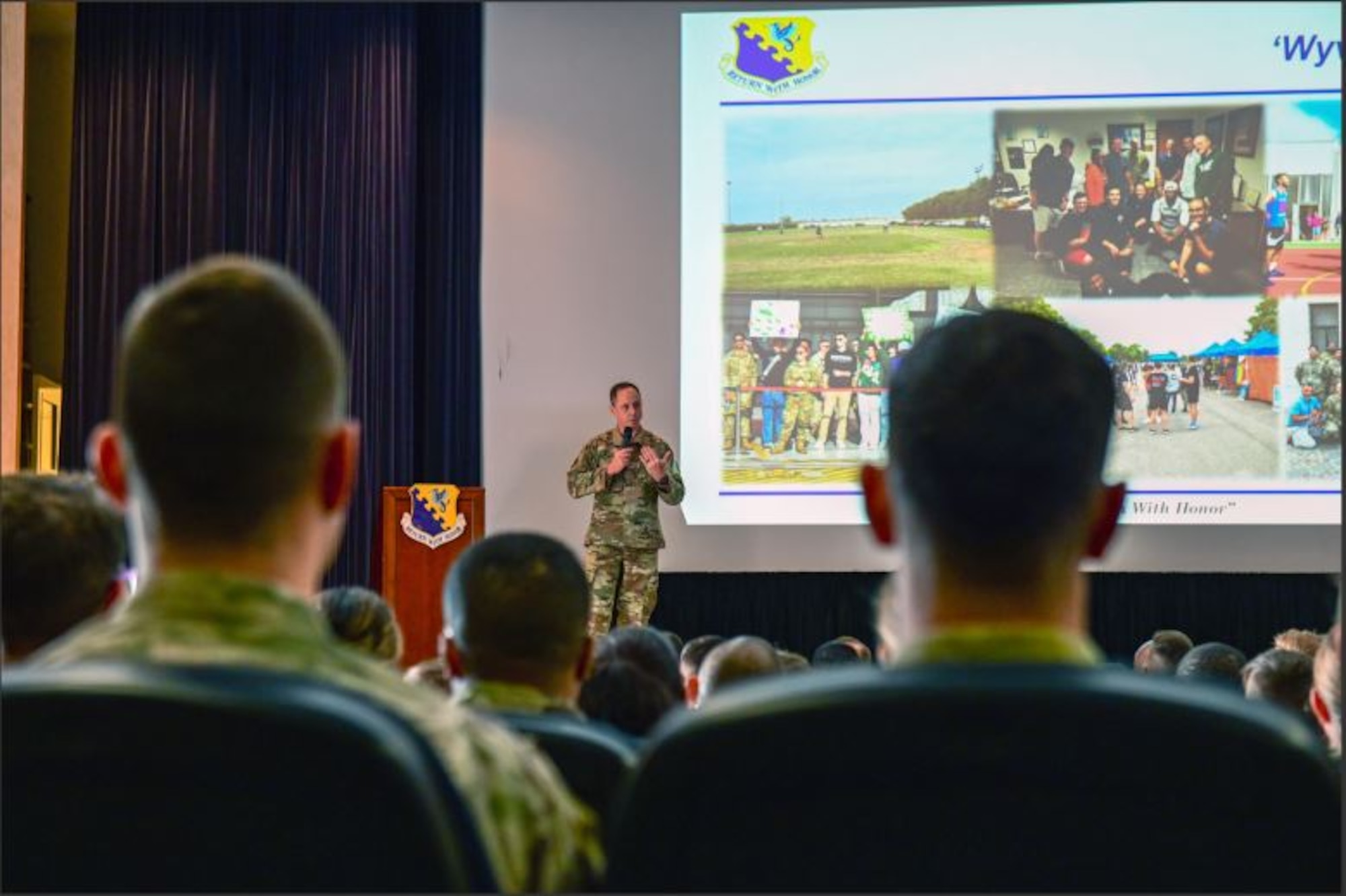 U.S. Air Force Brig. Gen. Tad Clark, 31st Fighter Wing commander, briefs during an all-call at Aviano Air Base, Italy