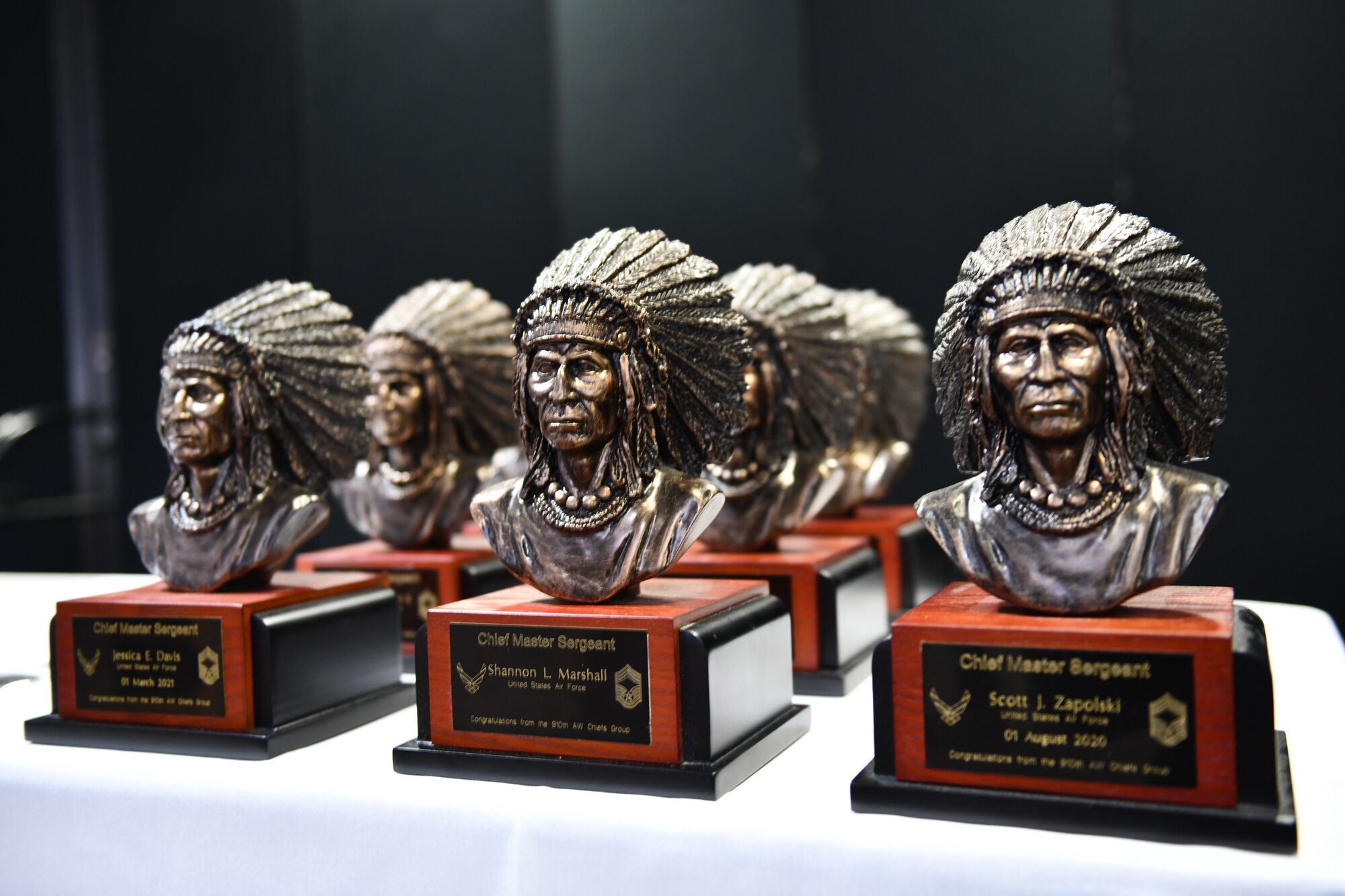 Commemorative busts given to new chief master sergeants are on display during a chief induction ceremony at Youngstown Air Reserve Station, Ohio, Oct. 15, 2022.