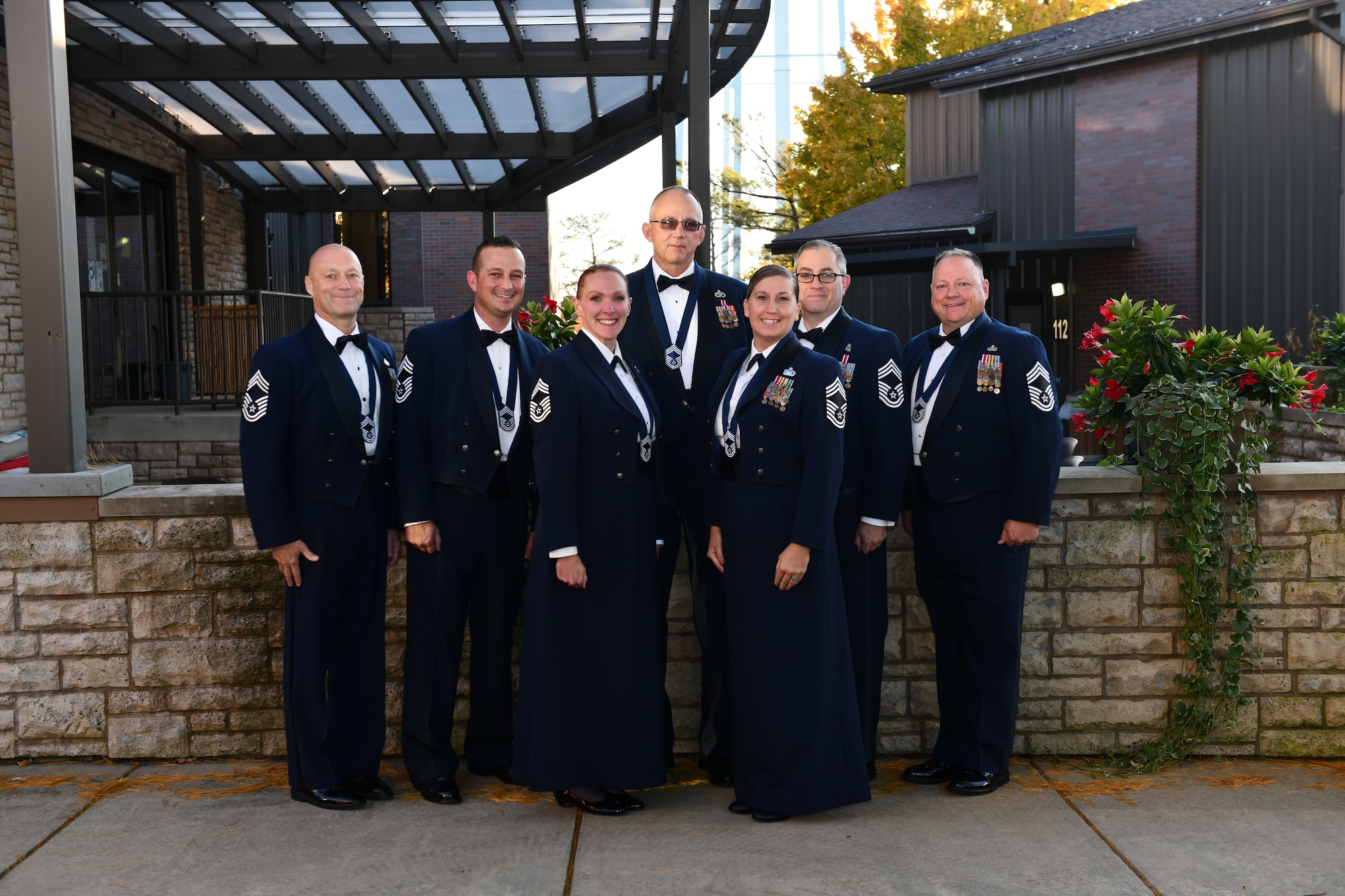 The 910th Airlift Wing's seven newest chief master sergeants post for a photo before an induction ceremony welcoming them to the highest enlisted rank of service, Oct. 15, 2022, at Youngstown Air Reserve Station, Ohio.
