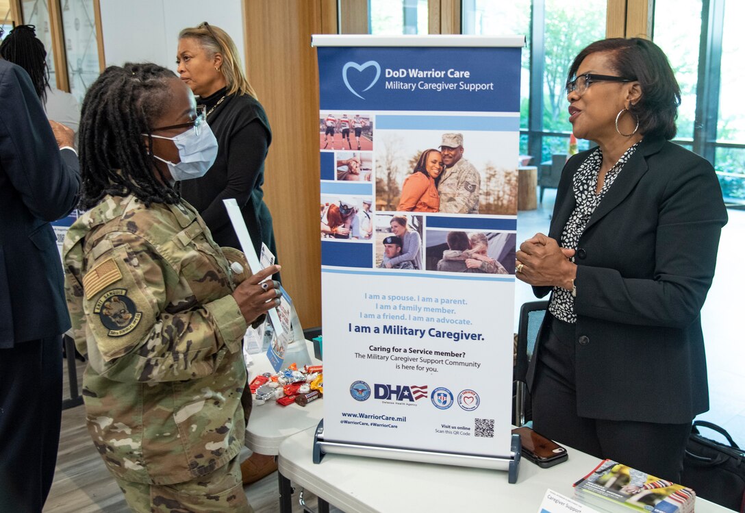 A service member speaks with a Military Caregiver Support staff member.