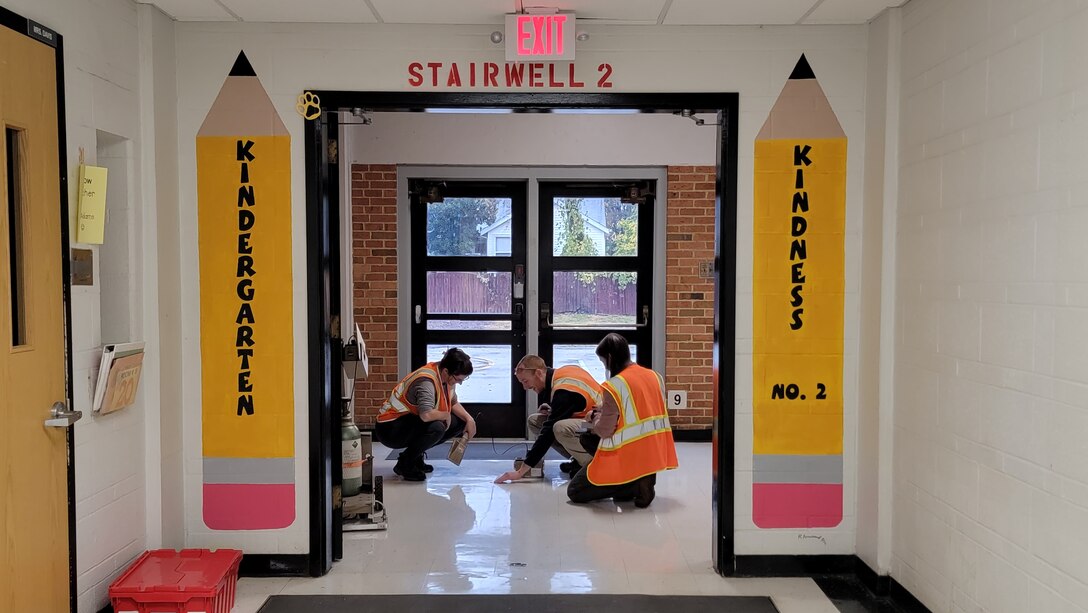 Contractors scan floors inside Jana Elementary School with radiation detection equipment. The structures investigation includes accessible surfaces. Sampling began Monday, Oct. 24, and preliminary results are expected within two weeks. (USACE photo by JP Rebello)