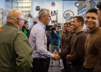 Jens Stoltenberg, Secretary General of NATO, speaks with Sailors aboard the Nimitz-class aircraft carrier USS George H.W. Bush (CVN 77) during the NATO-led vigilance activity Neptune Strike 2022.2 (NEST 22.2), Oct. 25, 2022.