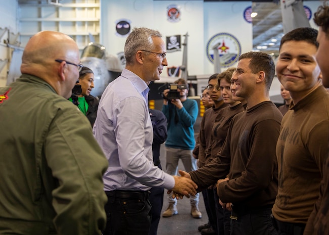 Jens Stoltenberg, Secretary General of NATO, speaks with Sailors aboard the Nimitz-class aircraft carrier USS George H.W. Bush (CVN 77) during the NATO-led vigilance activity Neptune Strike 2022.2 (NEST 22.2), Oct. 25, 2022.