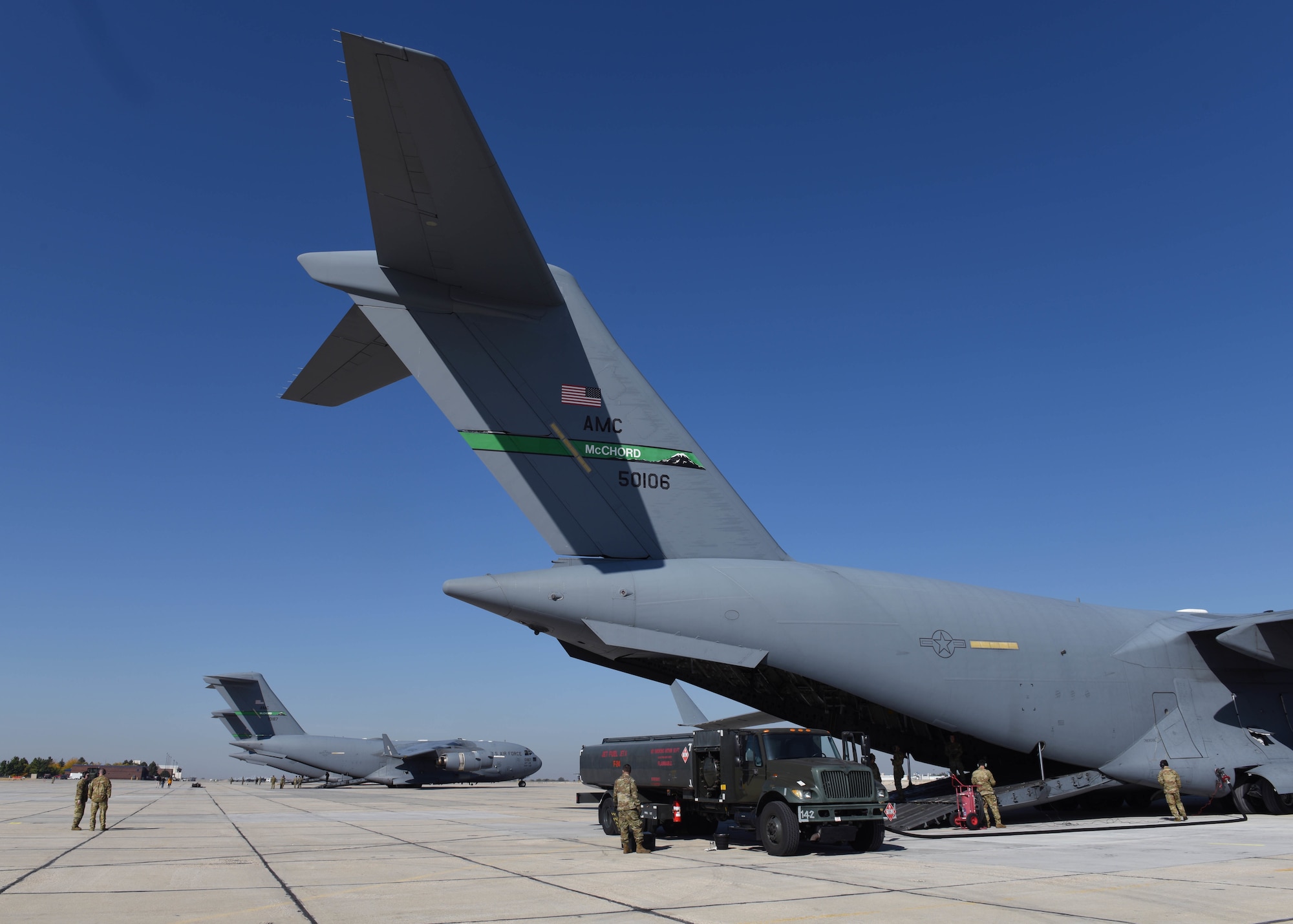 U.S. Airmen with the 62d Airlift Wing and 627th Air Base group perform wet wing refueling operations during Exercise Rainier War 22B at Gowen Field, Boise, Idaho, Oct. 20, 2022. Special fueling operations were conducted by the 62d AW’s C-17 Globemaster III and the 366th Fighter Wing’s F-15E Strike Eagle aircraft during Rainier War 22B to exhibit Air Mobility Command’s agile combat capabilities. (U.S. Air Force photo by Staff Sgt. Zoe Thacker)