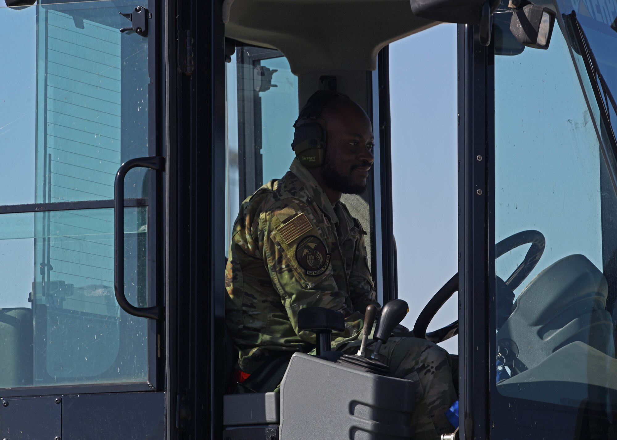 U.S. Air Force Senior Airman Solomon Katumba, aerial porter with the 62d Aerial Port Squadron, prepares to transport cargo with a forklift during Exercise Rainier War 22B at Gowen Field, Boise, Idaho, Oct. 20, 2022. Rainier War is a major exercise for the 62d Airlift Wing, including multiple airlift assets, joint partners and special operations forces. (U.S. Air Force photo by Staff Sgt. Zoe Thacker)