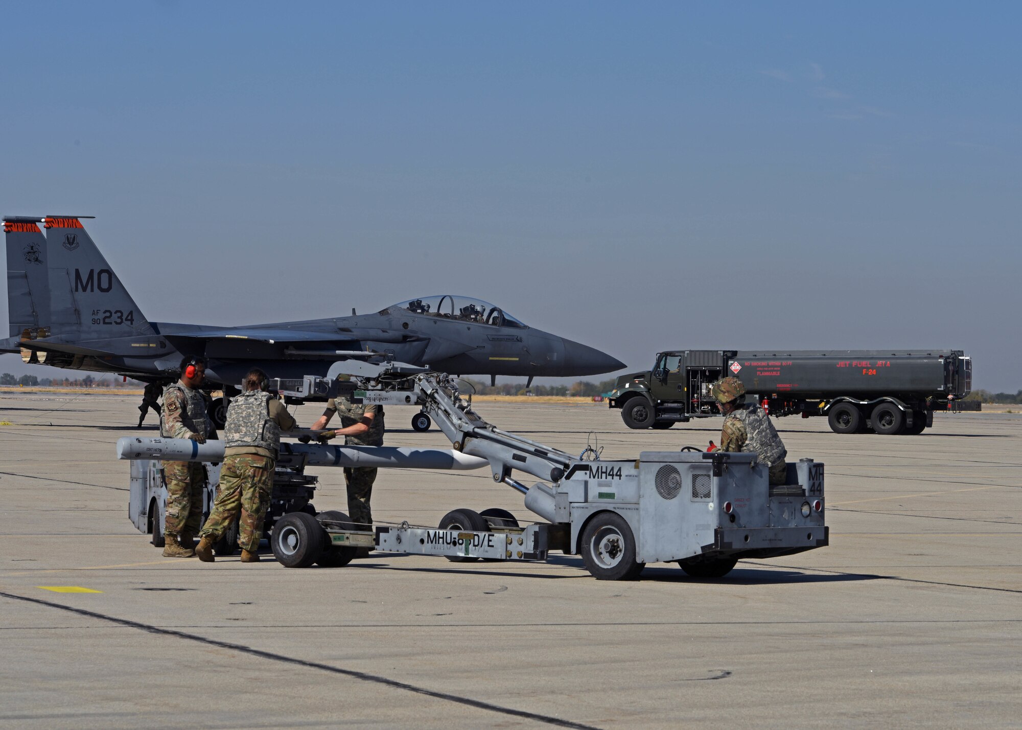 U.S. Airmen with the 366th Munitions Squadron prepare to load munitions onto an F-15E Strike Eagle from the 366th Fighter Wing, Mountain Home Air Force Base, Idaho, during Exercise Rainier War 22B at Gowen Field, Boise, Idaho, Oct. 20, 2022. In addition to showcasing Air Force Force Generation prioritization, Rainier War is the full-scale exercise used to train Multi-Capable Airmen at the 62d Airlift Wing at Joint Base Lewis-McChord, Washington. (U.S. Air Force photo by Staff Sgt. Zoe Thacker)