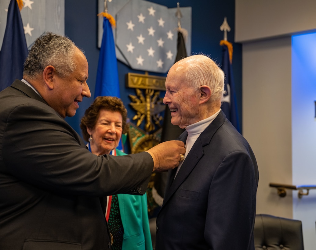 Secretary of the Navy Carlos Del Toro presents the Zachary and Elizabeth Fisher Distinguished Civilian Humanitarian Award to Arthur P. Miller Jr and Marjorie Miller at the Pentagon Oct. 27, 2022.