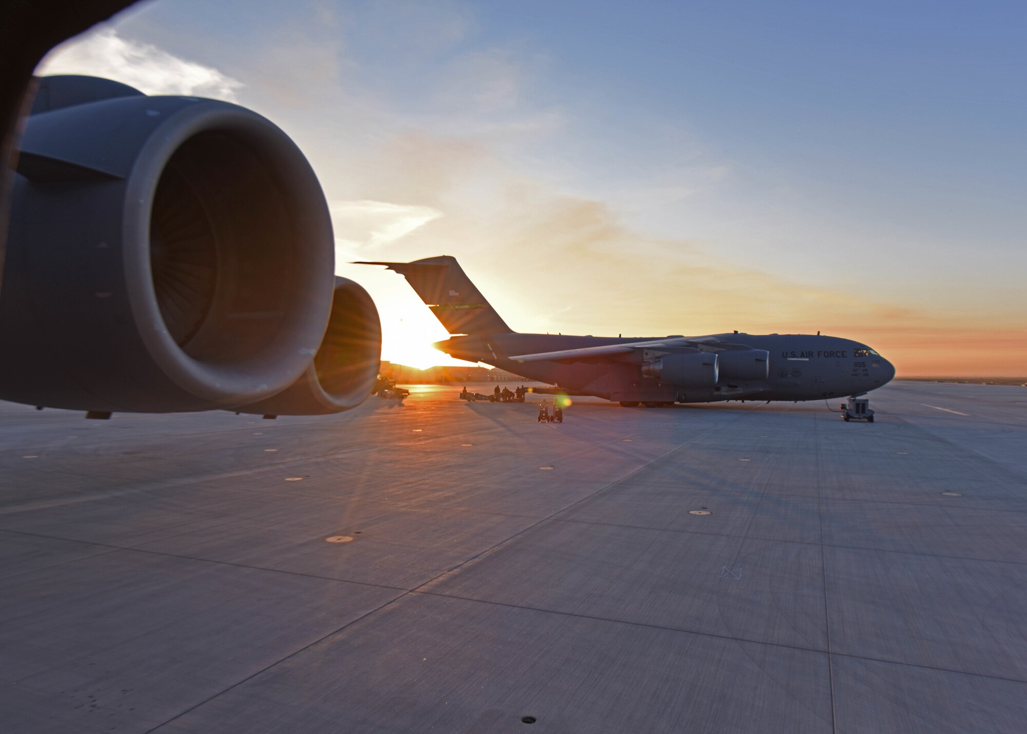 U.S. Airmen with the simulated 7th Expeditionary Airlift Squadron prepare to load cargo onto a C-17 Globemaster III aircraft during Exercise Rainier War 22B at Mountain Home Air Force Base, Idaho, Oct. 19, 2022. During this exercise, Air Mobility Command Airmen showcased the ability to provide fuel to fighter jets in designated locations so pilots do not have to return to their home stations for fueling or wait for an aerial refueling aircraft. Members of the 62d Airlift Wing, and their joint partners, loaded their own full R-11 refueler truck onto an aircraft and successfully refueled several fighter jets at various locations; the first time a C-17 Globemaster III aircraft has ever done this. (U.S. Air Force photo by Staff Sgt. Zoe Thacker)