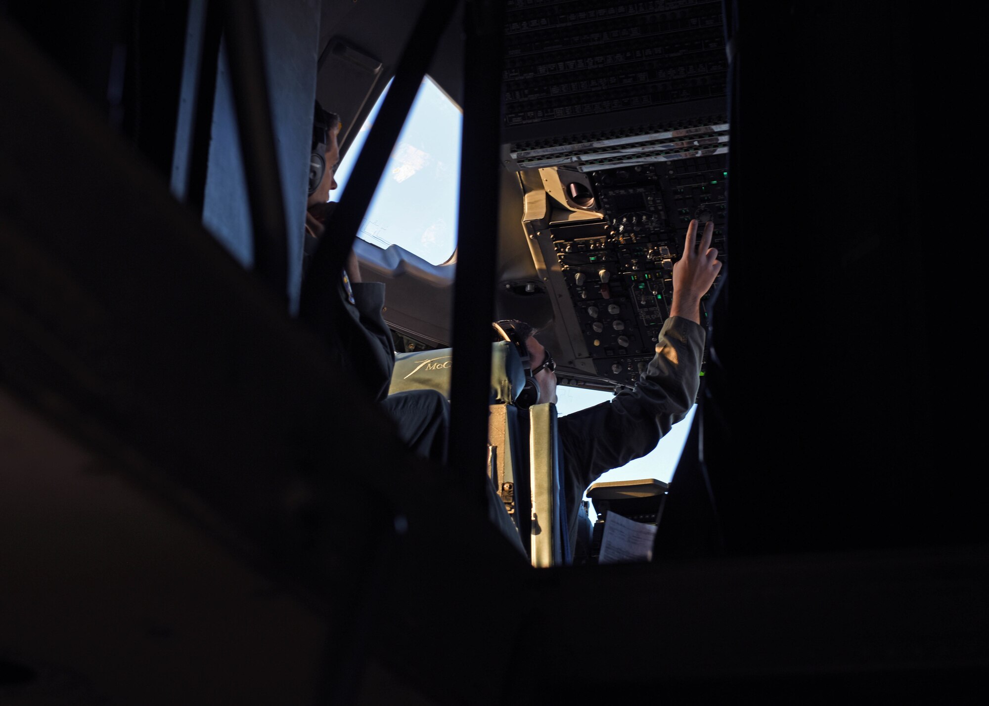 U.S. Air Force Capt. Chris Marookian, right, a C-17 Globemaster III pilot with the 21st Airlift Squadron, prepares for takeoff during Exercise Rainier War 22B at Mountain Home Air Force Base, Idaho, Oct. 19, 2022. Exercise Rainier War is a major exercise for the 62d Airlift Wing, including multiple airlift assets, joint partners and special operations forces. (U.S. Air Force photo by Staff Sgt. Zoe Thacker)