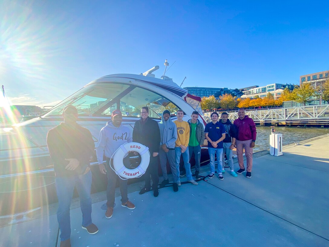 Participants pose for a group photo before the cruise.