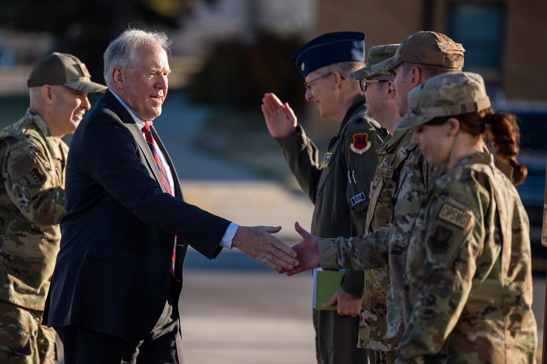 Secretary of the Air Force Frank Kendall is greeted by members of the 89th Attack Squadron during his visit to Ellsworth Air Force Base, S.D., October 27, 2022. The MQ-9 Reaper has been modified for an extended range of operations through the addition of external fuel tanks, providing for greater time on station and greater range. (U.S. Air Force photo by Senior Airman Austin McIntosh)