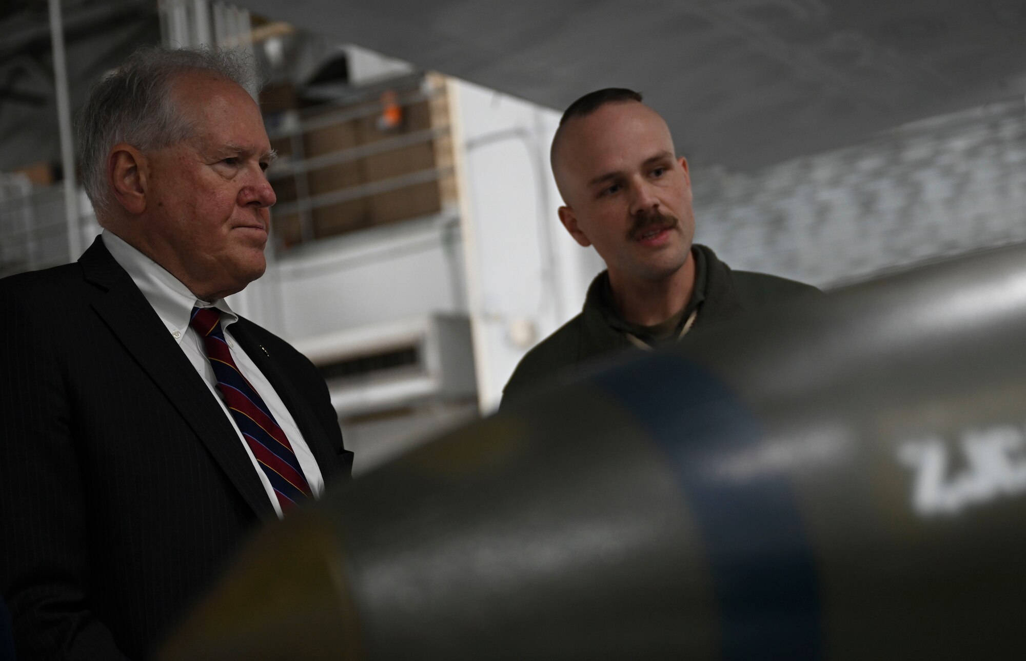 Secretary of the Air Force Frank Kendall is shown B-1B Lancer compatible munitions at Ellsworth Air Force Base, S.D., Oct. 27, 2022. The B-1 can rapidly deliver massive quantities of precision and non-precision munitions to combat any adversary, anywhere in the world, at any time. (U.S. Air Force photo by Airman Yendi Borjas)