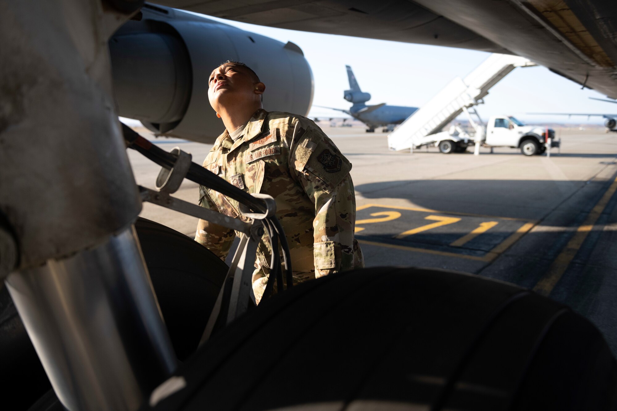 An Airman inspects a an aircraft