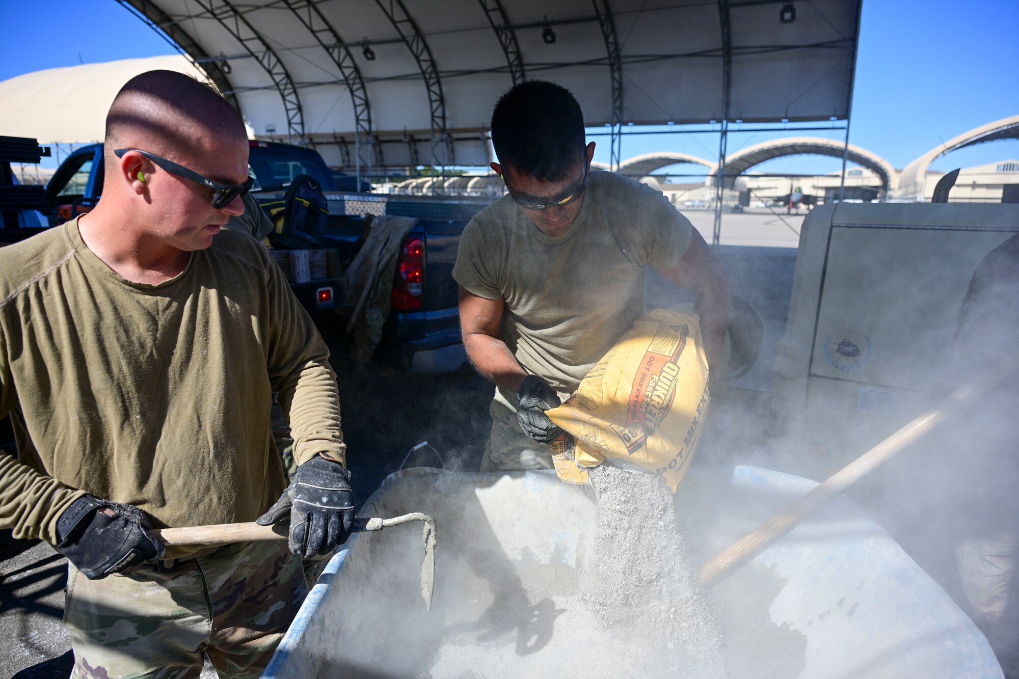 Pavement and equipment technicians assigned to the 4th Civil Engineer Squadron repair a patch of concrete at Seymour Johnson Air Force Base, North Carolina, Oct. 26, 2022. Pavements and equipment technicians earned the name “Dirt Boyz” during the Vietnam War because they were always covered in dirt, mud and concrete. (U.S. Air Force photo by Senior Airman Kevin Holloway)