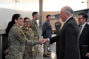 Secretary of the Air Force, Frank Kendall, coins Airmen at Barksdale Air Force Base, La., Oct. 27, 2022. Kendall noted the ability individual Airmen possess to innovate while enabling Air Force Global Strike Command’s mission and thanked them for their role in delivering a safe, secure, effective nuclear deterrent. (U.S. Air Force photo by Airman 1st Class Nia Jacobs)
