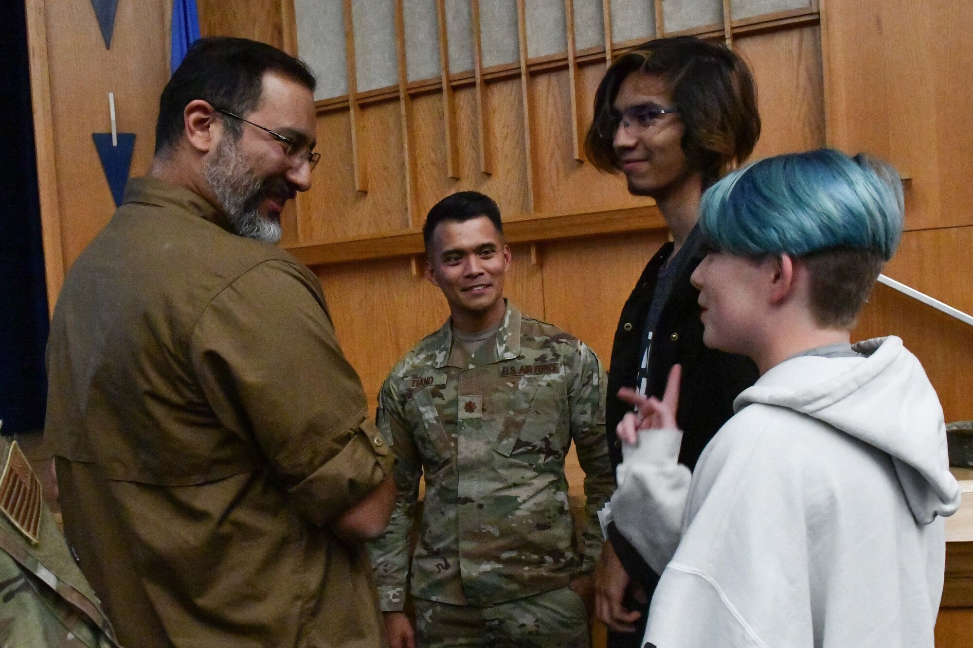 Rafael Chapa, 97th Air Mobility Wing drug demand reduction program manager, and Maj. Carlo Tiano, 97th Medical Group pharmacy operations chief, speak to students following a Red Ribbon Week presentation at Altus High School, Oklahoma, Oct. 26, 2022. Airmen expressed the dangers of drugs and the effect they can have on the user’s body, legal discipline, the signs of overdosing and how the brain reacts to taking certain narcotics. (U.S. Air Force photos by Airman 1st Class Miyah Gray)