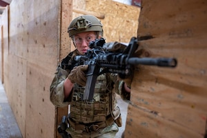 Staff Sgt. Witherspoon poses with her TRF certificate