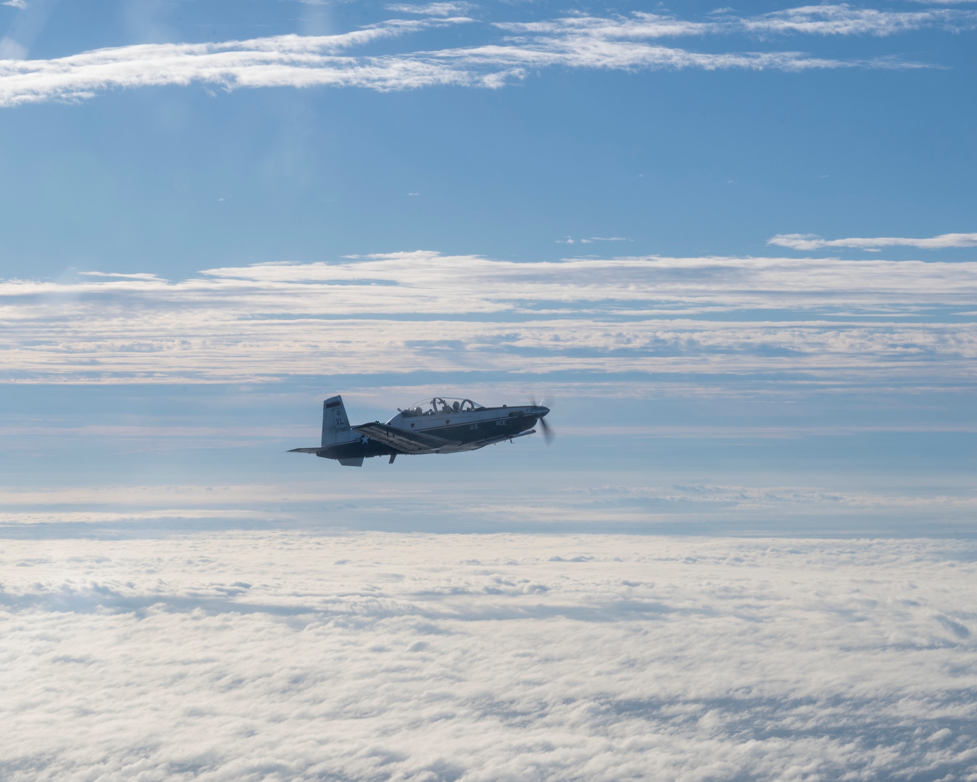 A T-6 Texan II flies from MacDill Air Force Base, Florida, to Eglin Air Force Base, Florida, as part of Ambush Florida on Oct. 14, 2022. Ambush Florida is a mission where pilots from the 85th Flying Training Squadron fly to a different region of the U.S. and "ambush" other bases helping pilots gain experience in long distance flights. (U.S. Air Force photo by Senior Airman Nicholas Larsen.)