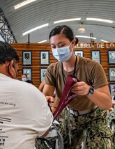 221027-N-LP924-1022 PUERTO BARRIOS, Guatemala (Oct. 27, 2022) Lt. j.g. Amanda Akiyana, a native of Santa Cruz, California, attached to the hospital ship USNS Comfort (T-AH 20), takes preliminary medical readings of a local patient at a medical site in Puerto Barrios, Guatemala, Oct. 27, 2022.  Comfort is deployed to U.S. 4th Fleet in support of Continuing Promise 2022, a humanitarian assistance and goodwill mission conducting direct medical care, expeditionary veterinary care, and subject matter expert exchanges with five partner nations in the Caribbean, Central and South America. (U.S. Navy photo by Mass Communication Specialist 3rd Class Sophia Simons)