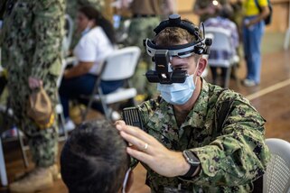 221027-N-LP924-1032 PUERTO BARRIOS, Guatemala (Oct. 27, 2022) Lt. Jared Widder, a native of Sheboygan, Wisconsin, attached to the hospital ship USNS Comfort (T-AH 20), conducts a preliminary eye exam on a local patient at a medical site in Puerto Barrios, Guatemala, Oct. 27, 2022. Comfort is deployed to U.S. 4th Fleet in support of Continuing Promise 2022, a humanitarian assistance and goodwill mission conducting direct medical care, expeditionary veterinary care, and subject matter expert exchanges with five partner nations in the Caribbean, Central and South America. (U.S. Navy photo by Mass Communication Specialist 3rd Class Sophia Simons)
