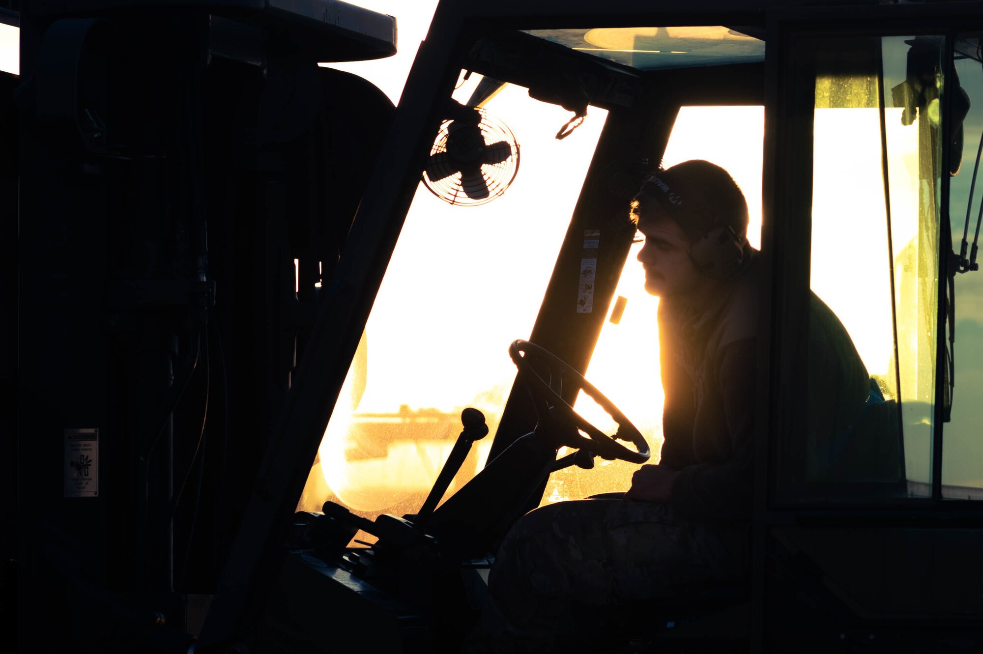 person drives forklift