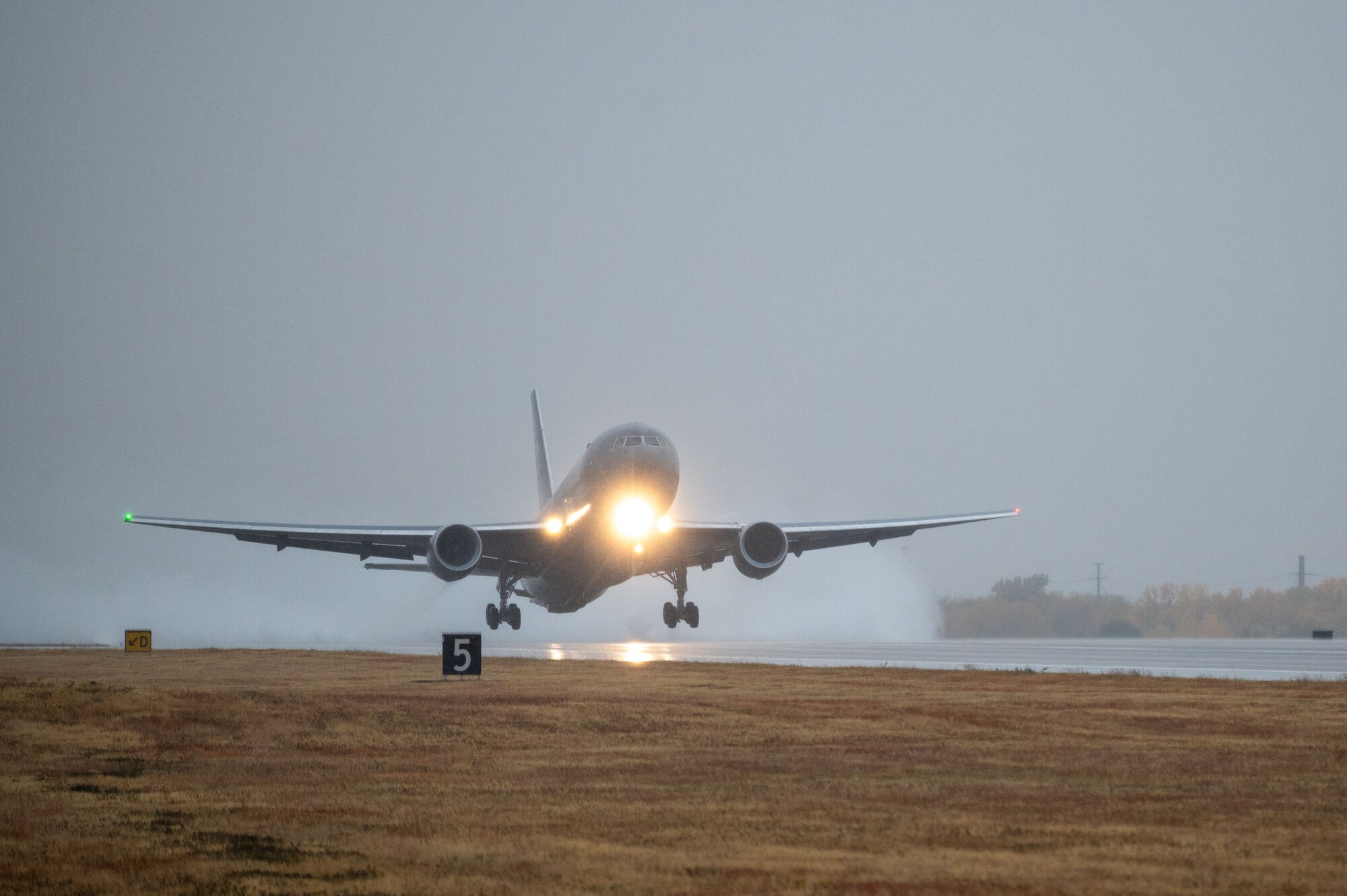 A KC-46A Pegasus takes off from McConnell Air Force Base, Kansas with a full crew compliment, Oct. 24, 2022. Once it arrived at the military test range, this KC-46 along with one other from McConnell validated procedures for operating with a limited aircrew. One KC-46 operated with a limited aircrew, while the second KC-46 operated with a full crew complement of subject matter experts able to provide assistance by radio, if needed. (U.S. Air Force photo by Airman 1st Class Brenden Beezley)