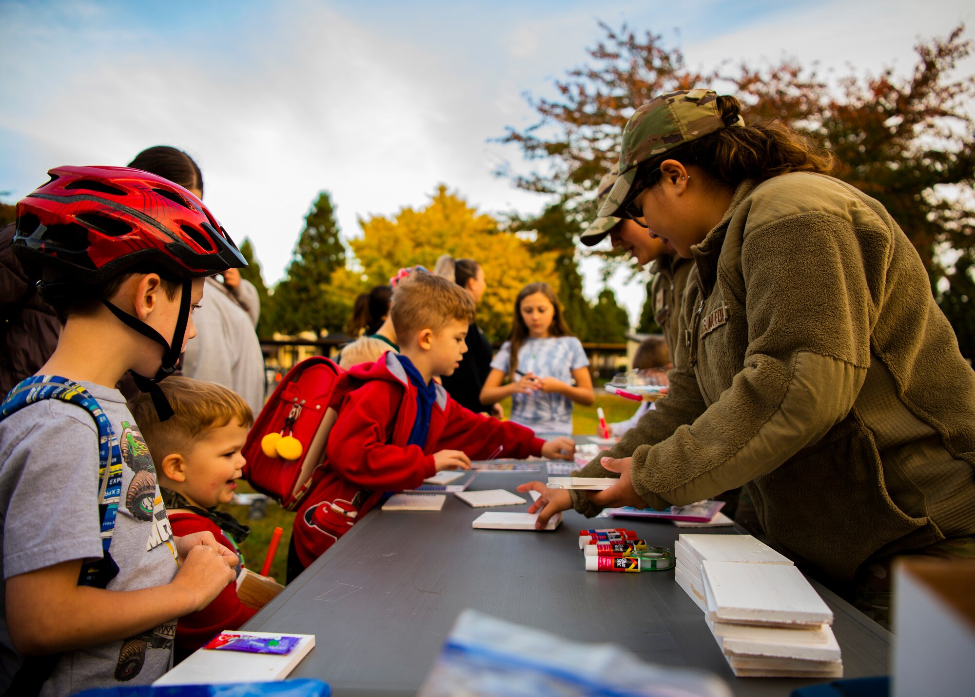 U.S. Air Force Airmen assigned to the 35th Security Forces Squadron give decorations to children during a bike rodeo at Misawa Air Base, Japan, Oct. 27, 2022. The bike rodeo was held in response to parent concerns to reinforce proper helmet wear and riding practices. (U.S. Air Force photo by Tech. Sgt. Jao’Torey Johnson)
