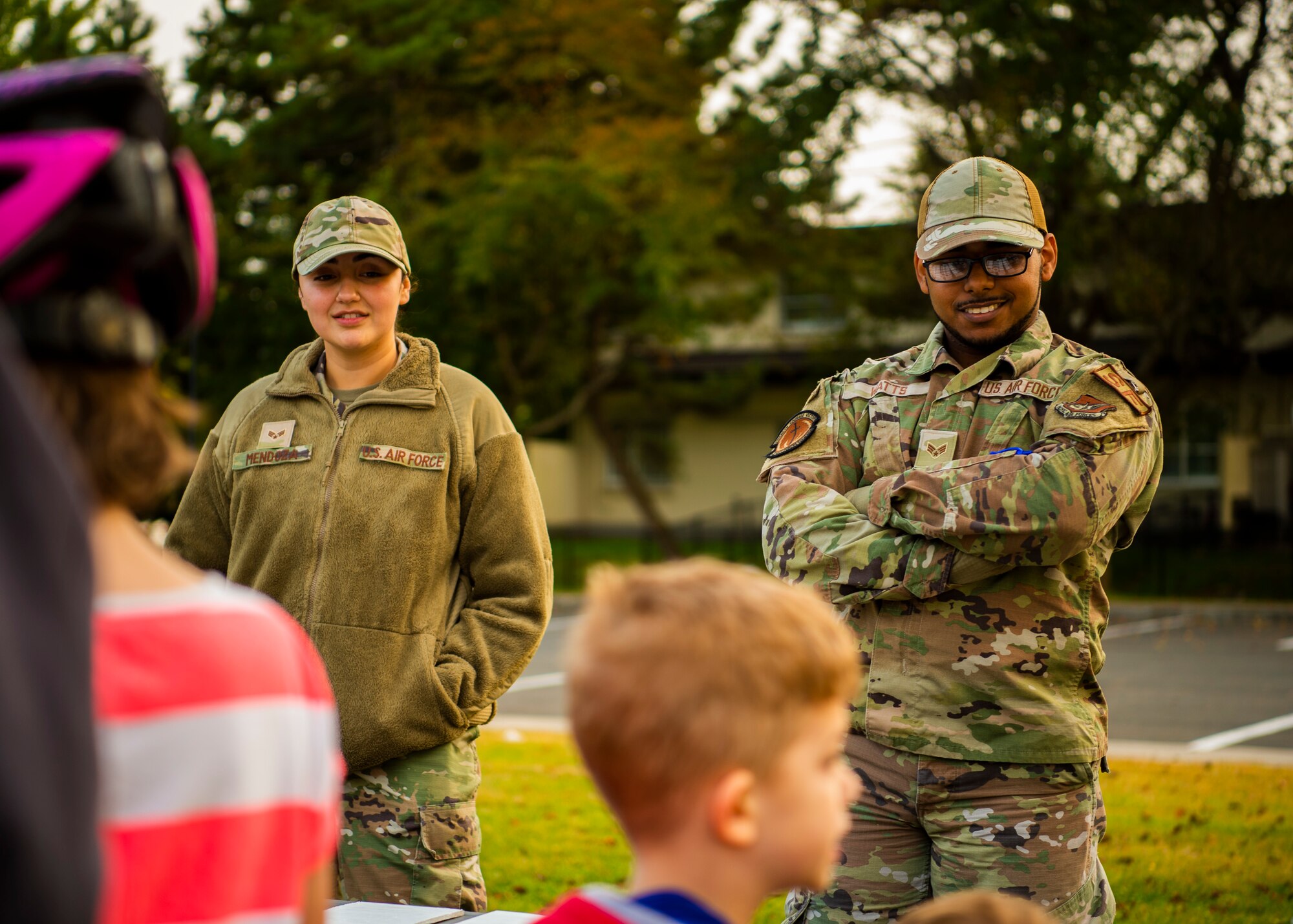 U.S. Air Force Airmen assigned to the 35th Security Forces Squadron give decorations to children during a bike rodeo at Misawa Air Base, Japan, Oct. 27, 2022. The bike rodeo was held in response to parent concerns to reinforce proper helmet wear and riding practices. (U.S. Air Force photo by Tech. Sgt. Jao’Torey Johnson)