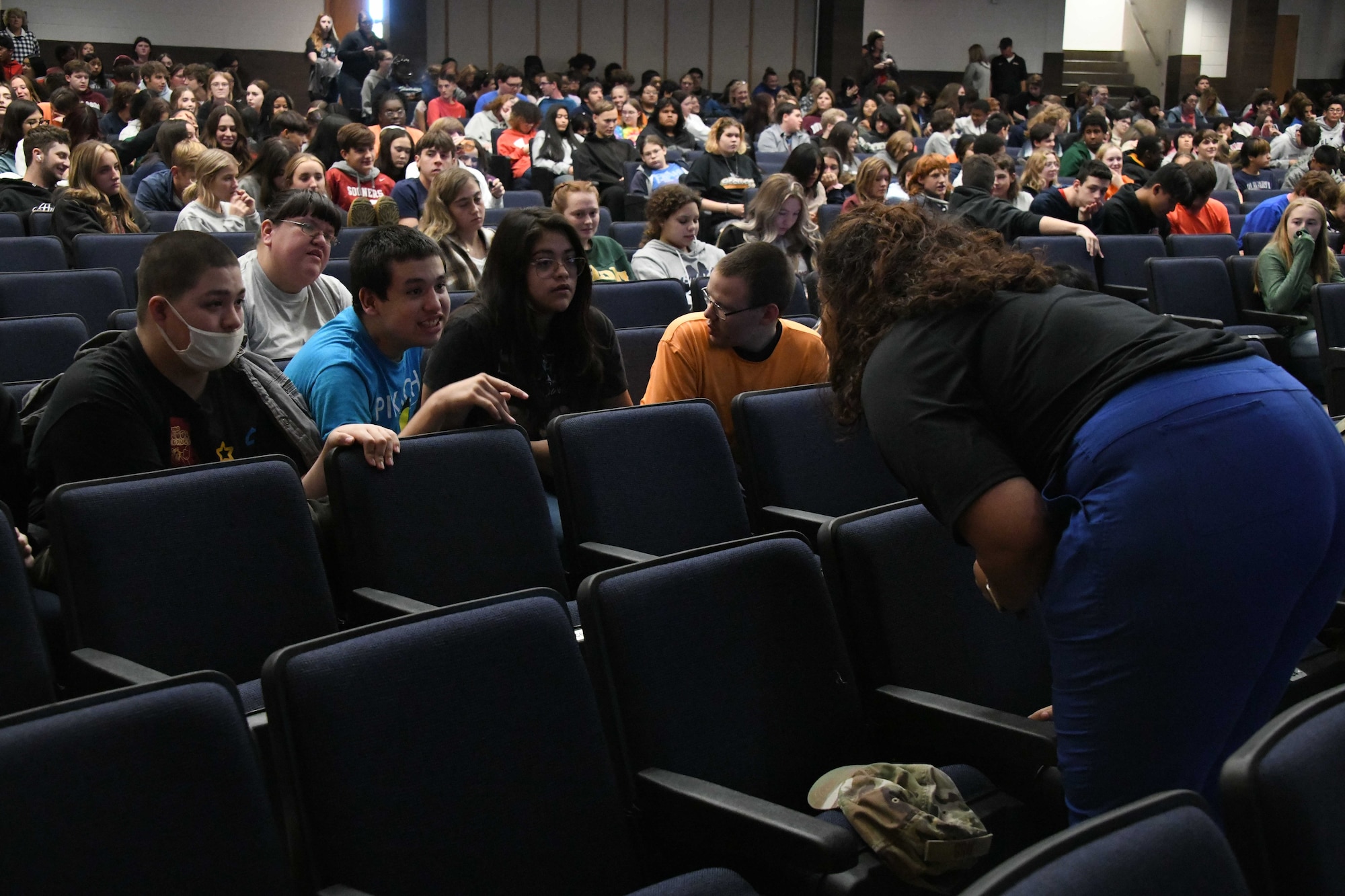 Ellissa Lott, 97th Medical Group pharmacy technician, answers a student’s question during a Red Ribbon Week presentation at Altus High School, Oklahoma, Oct. 26, 2022. Lott spoke about the risk associated with consuming illegal drugs, including identifying the signs of an overdose and how drug use can damage the pain receptors in one’s brain. (U.S. Air Force photo by Airman 1sst Class Miyah Gray)