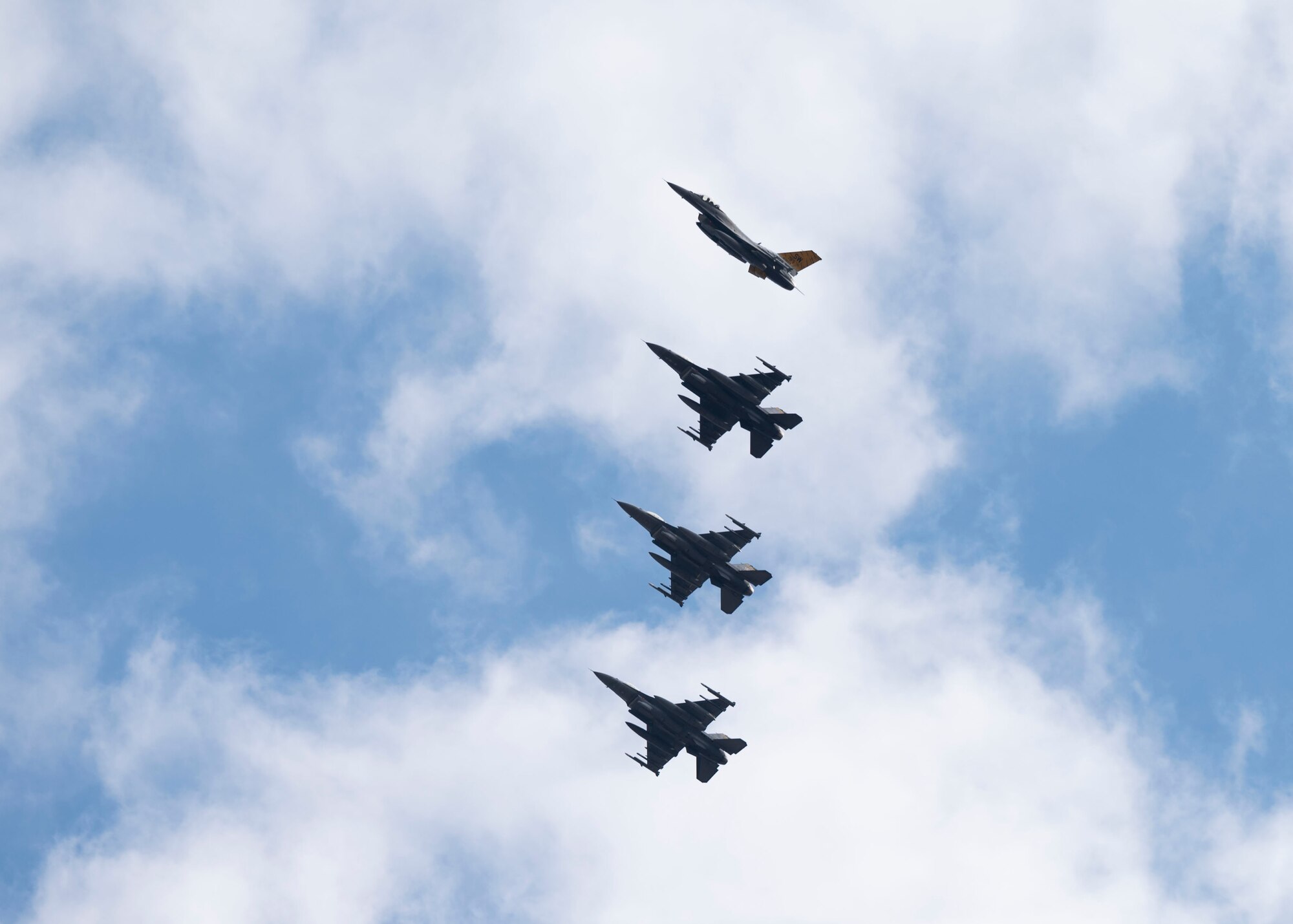 Four F-16C Fighting Falcons fly in formation