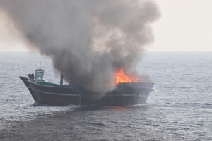 GULF OF OMAN (Oct. 29, 2022) A civilian fishing vessel burns in the Gulf of Oman, Oct. 29. The vessel, found to be smuggling illicit cargo, was set on fire by the fishing vessel’s crew as U.S. forces approached.