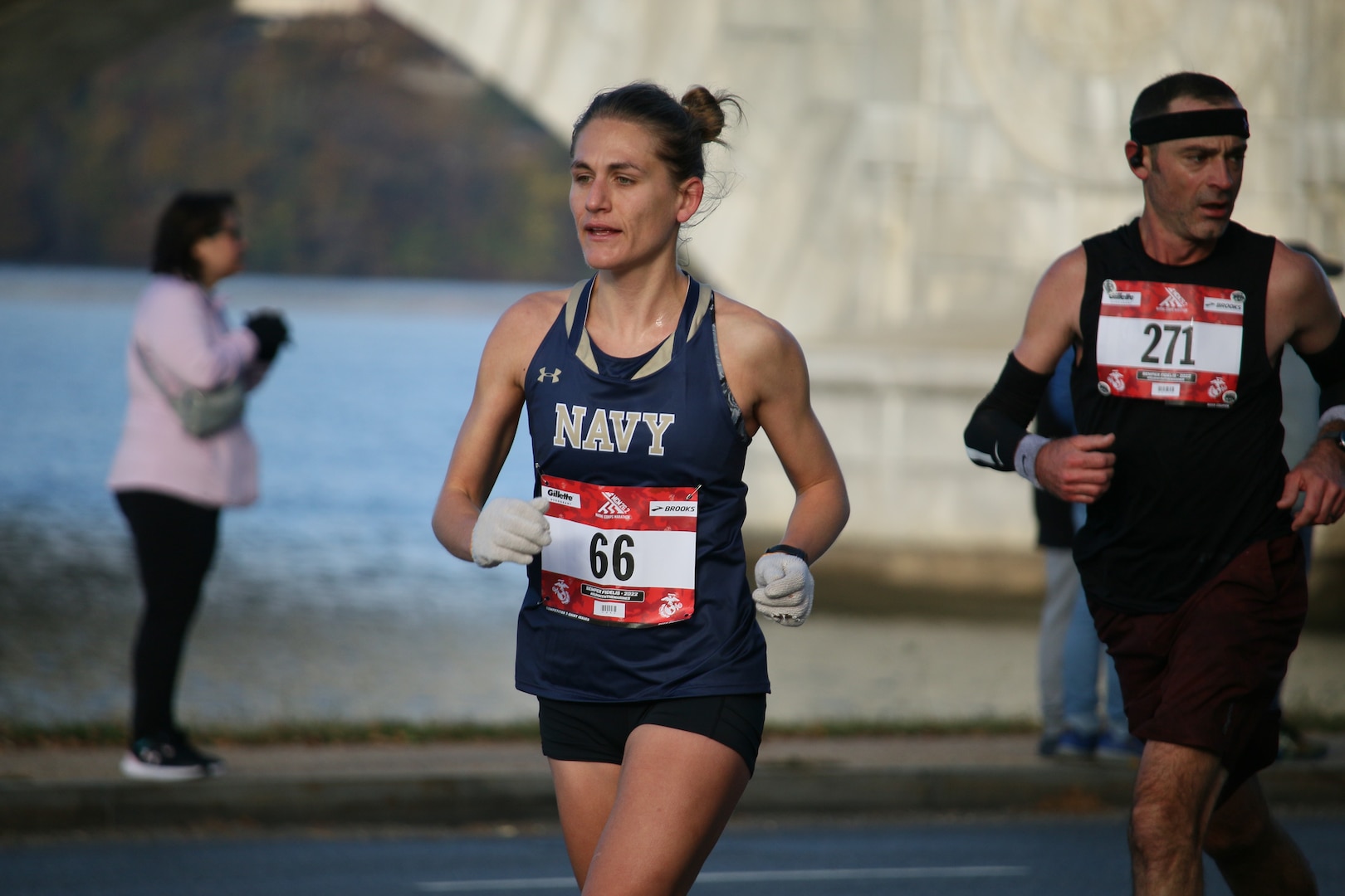 Navy Lt. Cmdr. Katherine Irgens of Naval Submarine Base New London, Conn.  jumps out in front of the competition to win the Armed Forces Women's Gold.  The 2022 Armed Forces Marathon Championship held in conjunction with the 47th Marine Corps Marathon in Washington, D.C.  The Armed Forces Championship features teams from the Marine Corps, Navy (with Coast Guard runners), and Air Force.  Department of Defense Photo by Mr. Steven Dinote - Released.