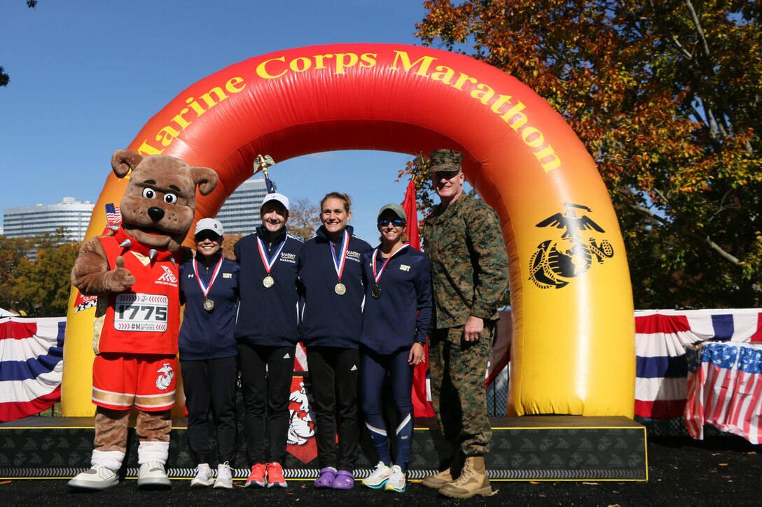 Navy Women capture Armed Forces Gold during the 2022 Armed Forces Marathon Championship held in conjunction with the 47th Marine Corps Marathon in Washington, D.C.  The Armed Forces Championship features teams from the Marine Corps, Navy (with Coast Guard runners), and Air Force.  Department of Defense Photo by Mr. Steven Dinote - Released.