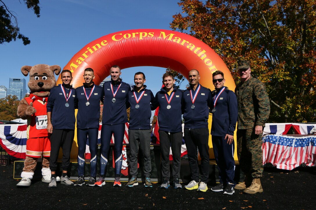 Navy Men win silver during the 2022 Armed Forces Marathon Championship held in conjunction with the 47th Marine Corps Marathon in Washington, D.C.  The Armed Forces Championship features teams from the Marine Corps, Navy (with Coast Guard runners), and Air Force.  Department of Defense Photo by Mr. Steven Dinote - Released.