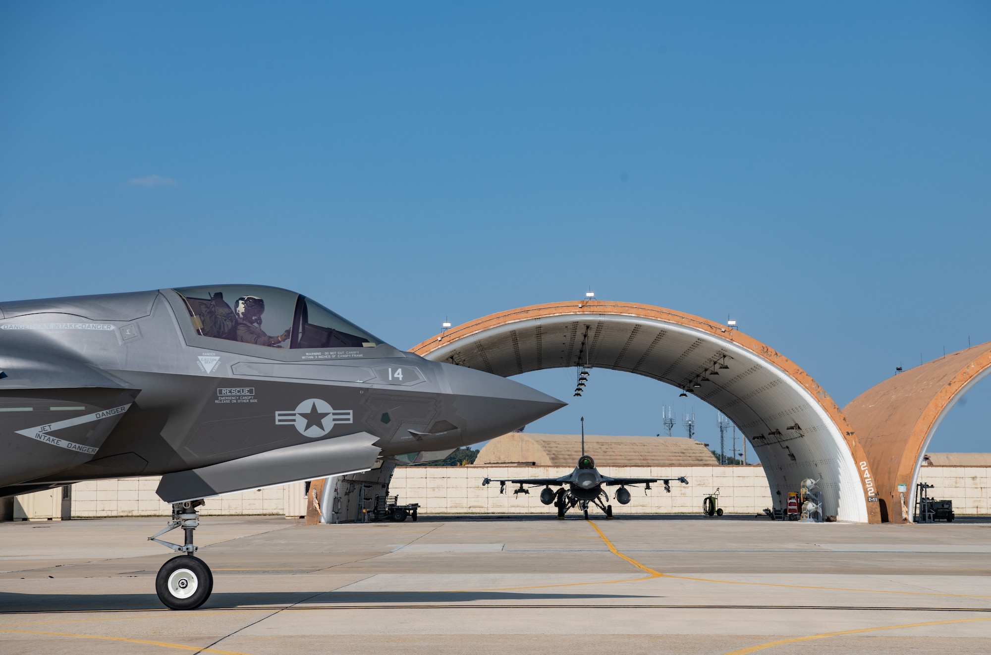A U.S. Marine Corps F-35 Lightning II from Marine Fighter Attack Squadron (VMFA) 242, out of Iwakuni, Japan, taxis by an 8th Operations Group F-16 Fighting Falcon, at Kunsan Air Base, Republic of Korea, Oct. 31, 2022. The aircraft traveled to Kunsan as a part of the Pacific Air Forces command sponsored VIGILANT STORM 23 exercise. VIGILANT STORM is a regularly scheduled training designed to enhance the combat readiness and survivability of U.S. and ROK forces and sustain capabilities, further strengthening the ROK-U.S. Alliance. (U.S. Air Force photo by Staff Sgt. Sadie Colbert)