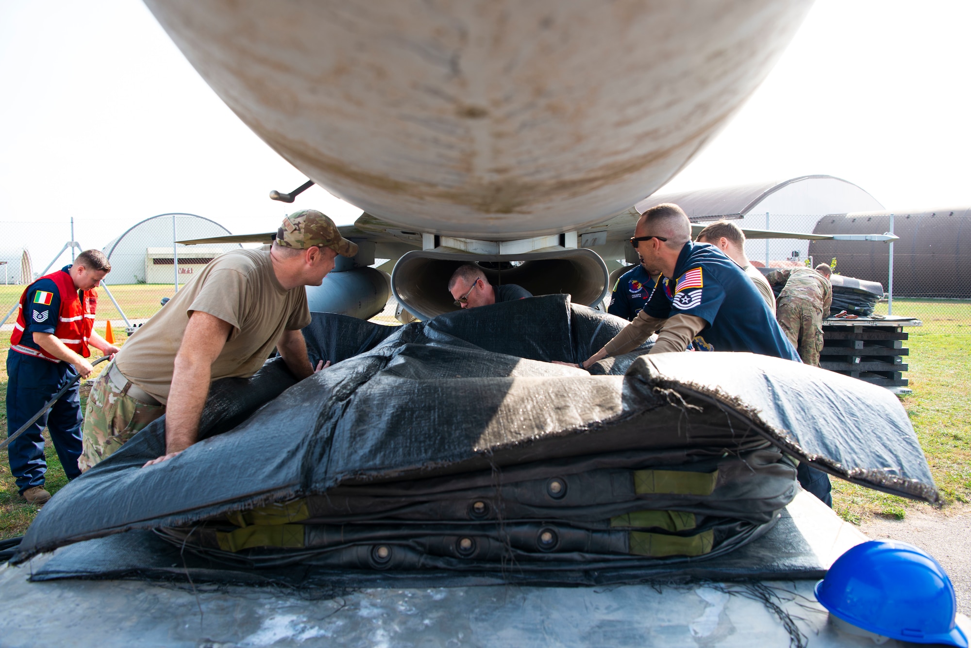 U.S. Airmen pack up a lift bag during a crashed, damaged or disabled aircraft recovery (CDDAR) training at Aviano Air Base, Italy, Oct. 20, 2022. These trainings give Airmen the practice needed to execute real-world recoveries effectively. (U.S. Air Force photo by Airman 1st Class Thomas Calopedis)