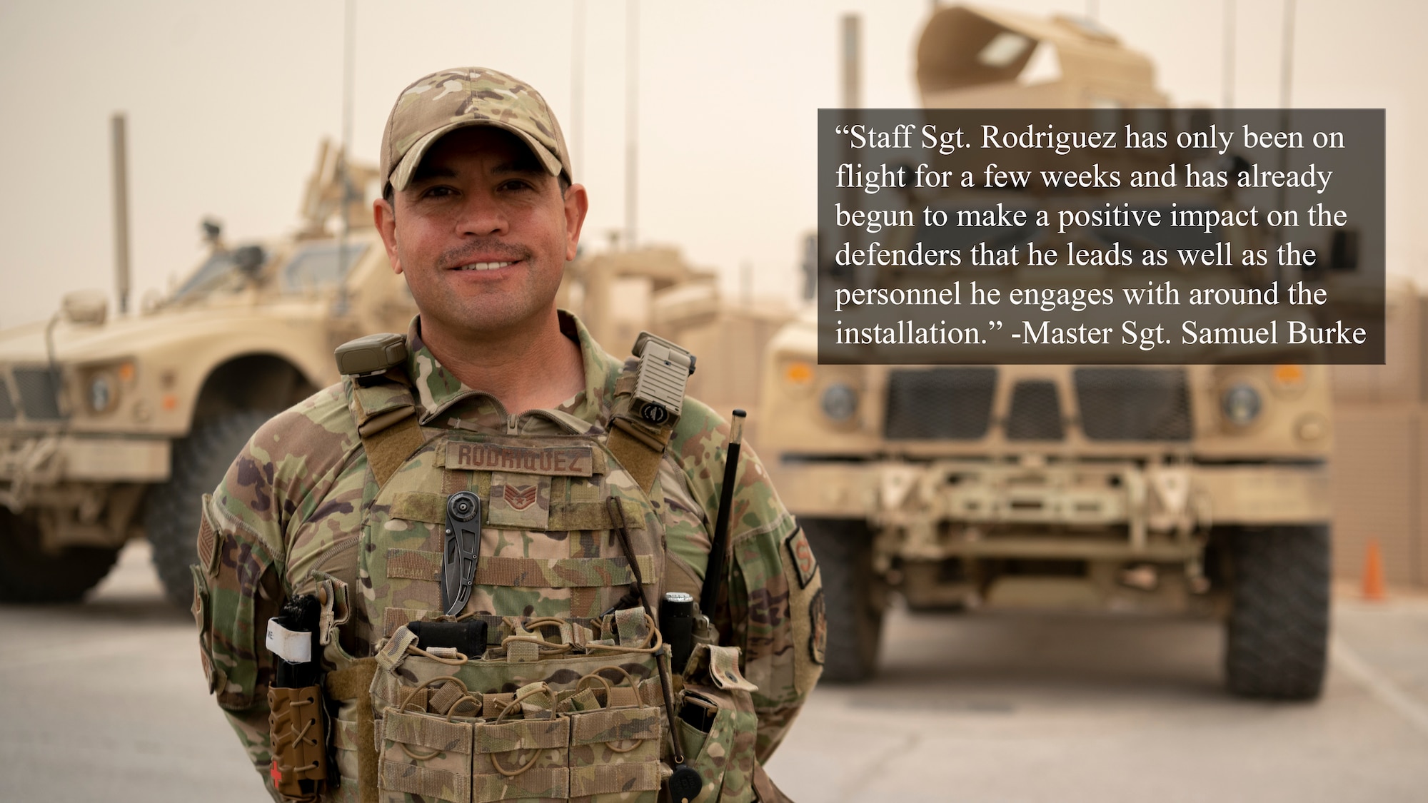 U.S. Air Force Staff Sgt. Jason Rodriguez, 332d Expeditionary Security Forces Squadron, Quick Reaction Force, poses in front of two Mine Resistant Ambush Protected vehicles at an undisclosed location, Southwest Asia, Oct. 24, 2022. Rodriguez is the recipient of the 332d Air Expeditionary Wing’s, “Warrior of the Week,” for the week of Oct. 31, 2022. Warrior of the Week is a competitive recognition program that highlights significant contributions made by individual Airmen who raise the Red Tail standard and enhance the Air Force mission and capabilities. (U.S. Air Force photo by Tech. Sgt. Jeffery Foster)