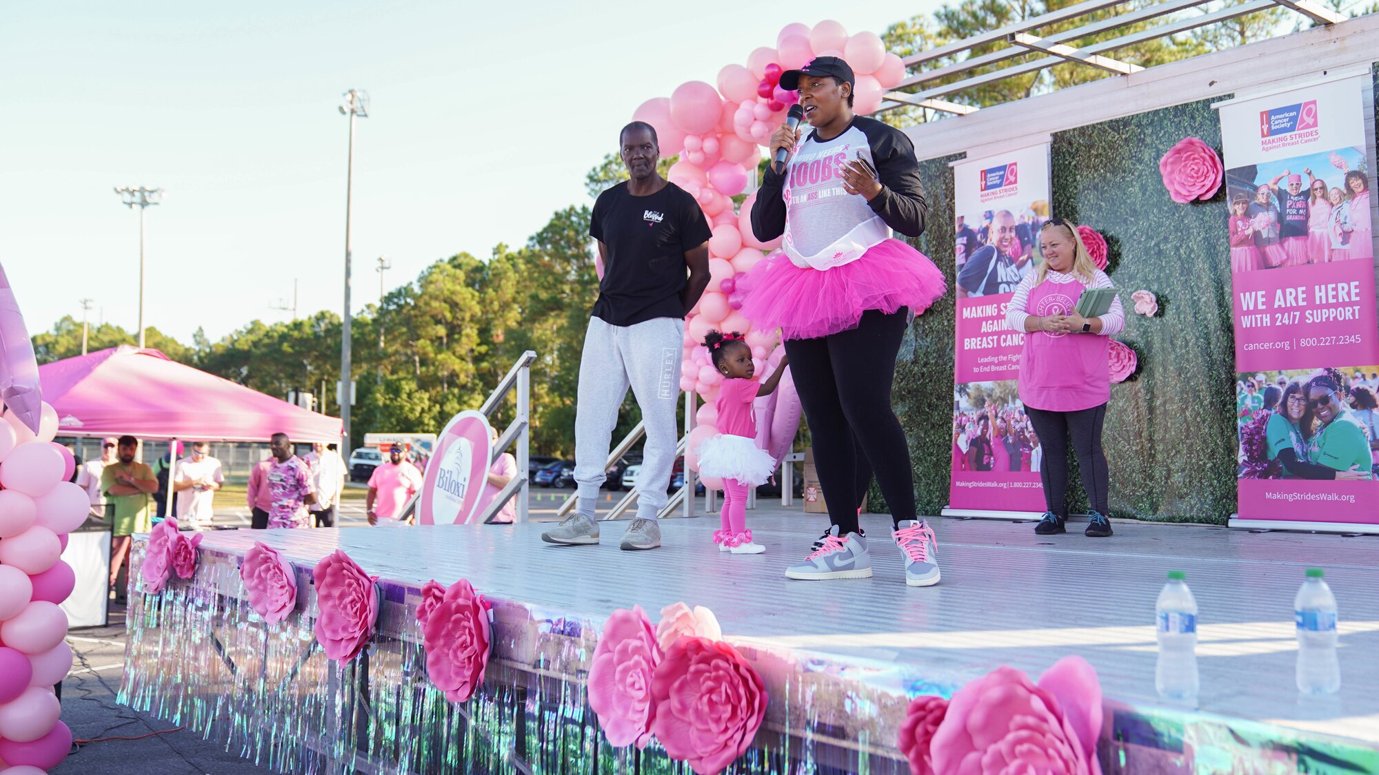 U.S. Air Force Tech. Sgt. LeVonya Davis, 81st Medical Support Squadron medical information systems section chief, speaks to the a crowd at the Mississippi Gulf Coast Strides Against Breast Cancer 5K in held at the AJ Holloway Sports Complex in Biloxi, Mississippi, Oct. 15, 2022.