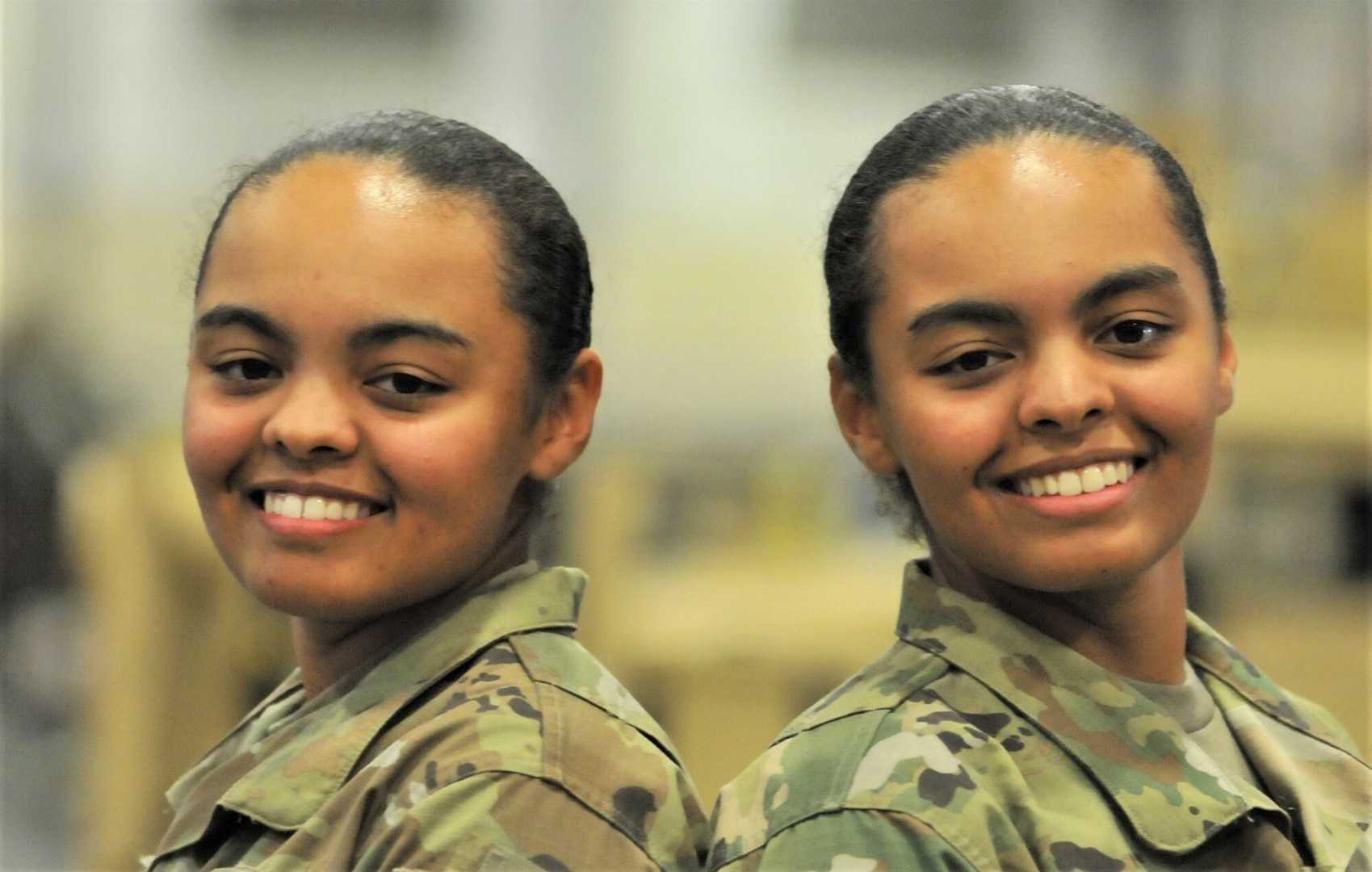 Pvts. Jaiden and Teagen Gregory pose for a photo in the shop training area of the Ordnance School’s Stever Hall at Fort Lee, Virginia. The twins, trained as 91B wheeled vehicle mechanics, said they’re grateful to the Army National Guard for giving them a head start on their careers after quitting high school to support their family.