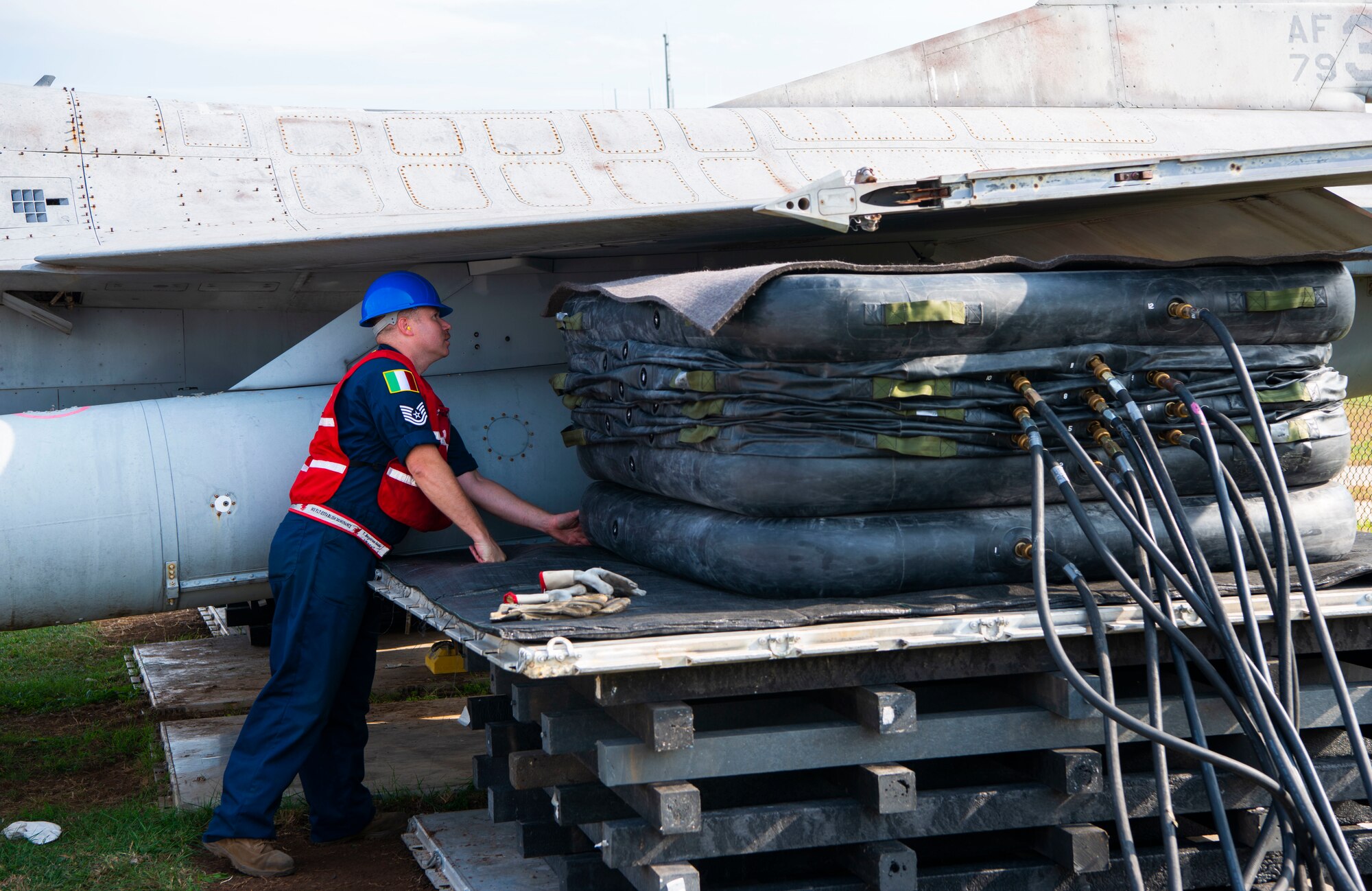 Tech. Sgt. Tyler Borgstrom, 31st Maintenance Squadron crashed, damaged or disabled aircraft recovery (CDDAR) noncommissioned officer in charge, inspects a bag lift during a CDDAR training at Aviano Air Base, Italy, Oct. 20, 2022. The CDDAR section used teamwork and communication to get the job done. (U.S. Air Force photo by Airman 1st Class Thomas Calopedis)