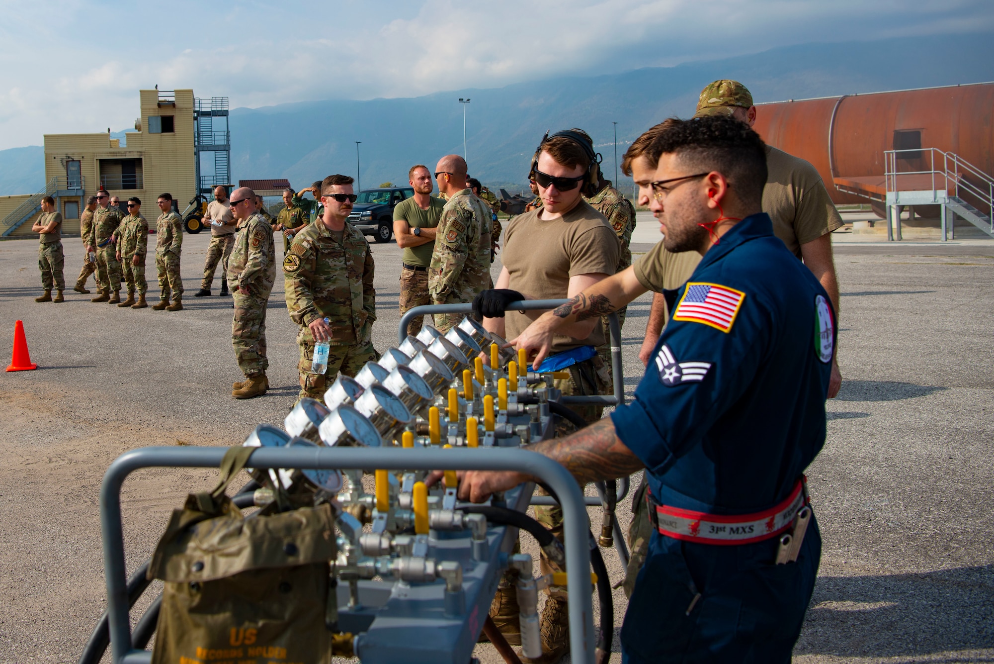 U.S. Airmen observe a bag lift during a crashed, damaged or disabled aircraft recovery (CDDAR) training at Aviano Air Base, Italy, Oct. 20, 2022. U.S. Airmen from Ramstein as well as Spangdahlem Air Force Base in Germany and the Italian air force were involved in the joint training. (U.S. Air Force photo by Airman 1st Class Thomas Calopedis)