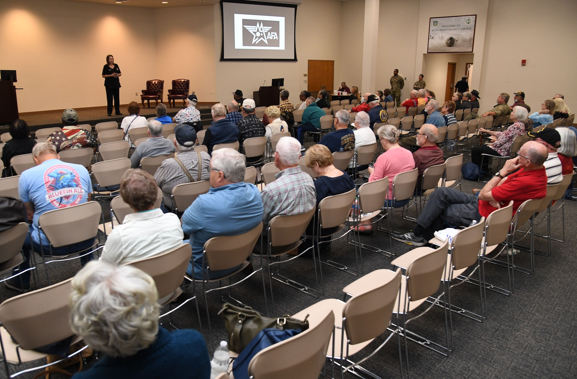 U.S. Air Force retired Tech. Sgt. Tina O'Shields, 81st Training Wing volunteer service officer, delivers remarks during Retiree Appreciation Day inside the Roberts Consolidated Aircraft Maintenance Facility at Keesler Air Force Base, Mississippi, Oct. 28, 2022.
