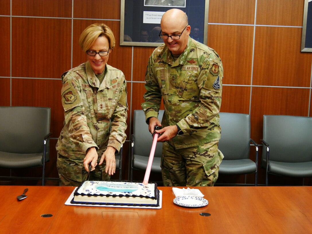 Air Force Research Laboratory Commander Maj. Gen. Heather Pringle and Chief Master Sgt. James “Bill” Fitch, AFRL command chief, cut the cake to celebrate the 25th anniversary of one AFRL at Wright-Patterson Air Force Base, Ohio, Oct. 28, 2022. One AFRL refers to the 1997 coming together of four U.S. Air Force laboratory facilities, then called super labs, and the Air Force Office of Scientific Research under a unified science and technology organization. (U.S. Air Force photo / Justin Hayward)