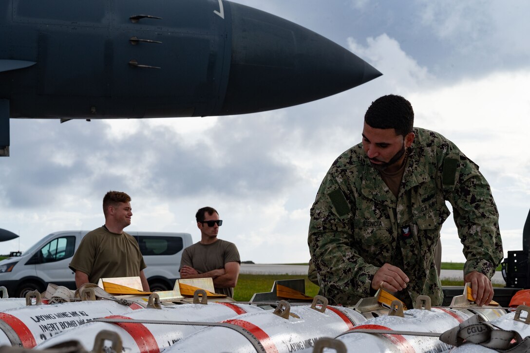 U.S. Navy Petty Officer 2nd Class Brian Mencia, Navy Munitions Command quality assurance safety officer assigned to the Pacific Unit, Guam, inspects an MK-62 Quickstrike Naval mine in support of a Bomber Task Force mission at Andersen Air Force Base, Guam, Oct. 21, 2022. BTF missions contribute to joint force lethality and deter aggression in the Indo-Pacific by demonstrating the U.S. Air Force’s ability to operate anywhere in the world at any time in support of the National Defense Strategy. (U.S. Air Force photo by Staff. Sgt. Hannah Malone)