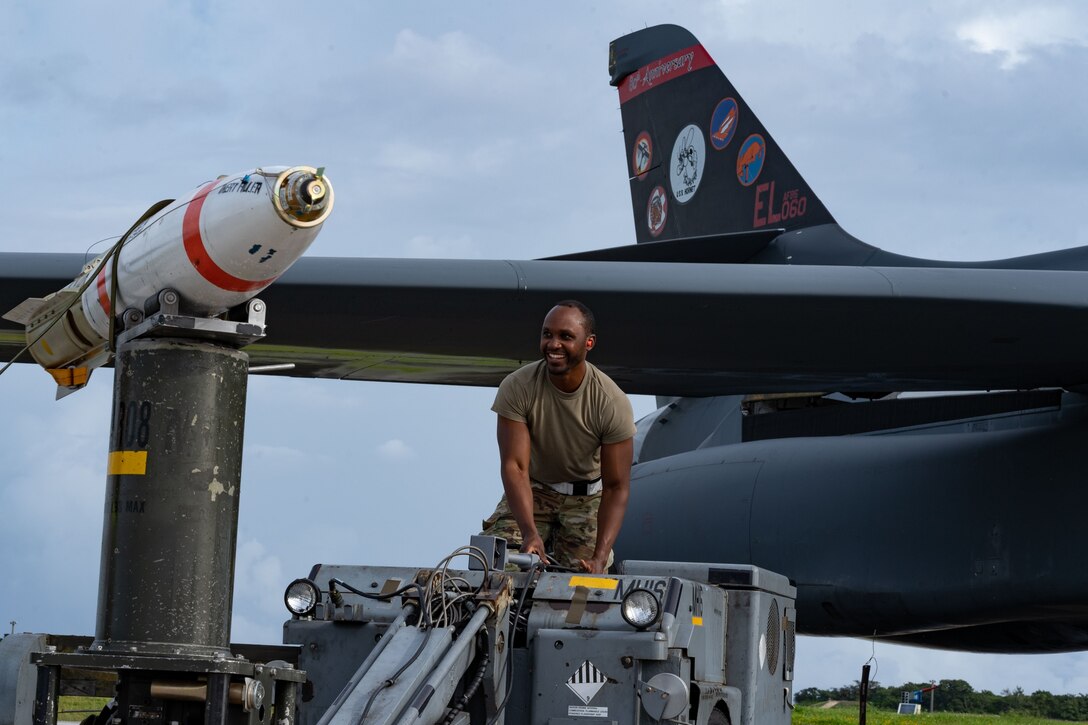 U.S. Air Force Senior Airman Daryl Walters, 28th Munitions Squadron weapons lead crew member assigned to Ellsworth Air Force Base, South Dakota, prepares to load an MK-62 Quickstrike Naval mine onto a B-1B Lancer in support of a Bomber Task Force mission at Andersen AFB, Guam, Oct. 21, 2022. Pacific Air Forces remains ready and postured to respond to and support global operations by operating with a variety of aircraft and units in the Indo-Pacific. (U.S Air Force photo by Staff Sgt. Hannah Malone)