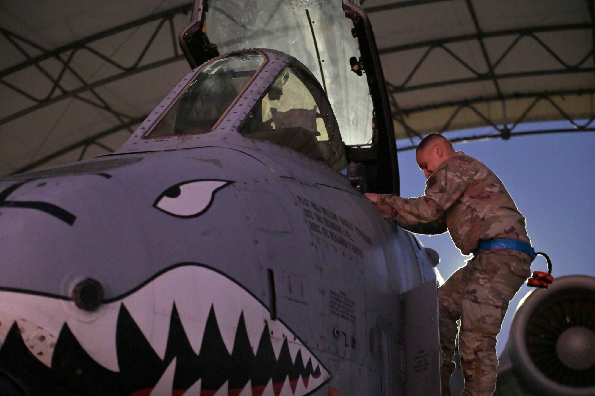 U.S. Air Force Senior Airman Favian Trujillo,74th Fighter Generation Squadron crew chief, climbs the steps to the cockpit of an A-10C Thunderbolt II at Moody Air Force Base, Georgia, Oct. 16, 2022. The 23rd Wing deployed A-10C Thunderbolt II aircraft and support personnel to Andersen Air Force Base, Guam for a routine Dynamic Force Employment Operation. (U.S. Air Force photo by Senior Airman Rebeckah Medeiros)