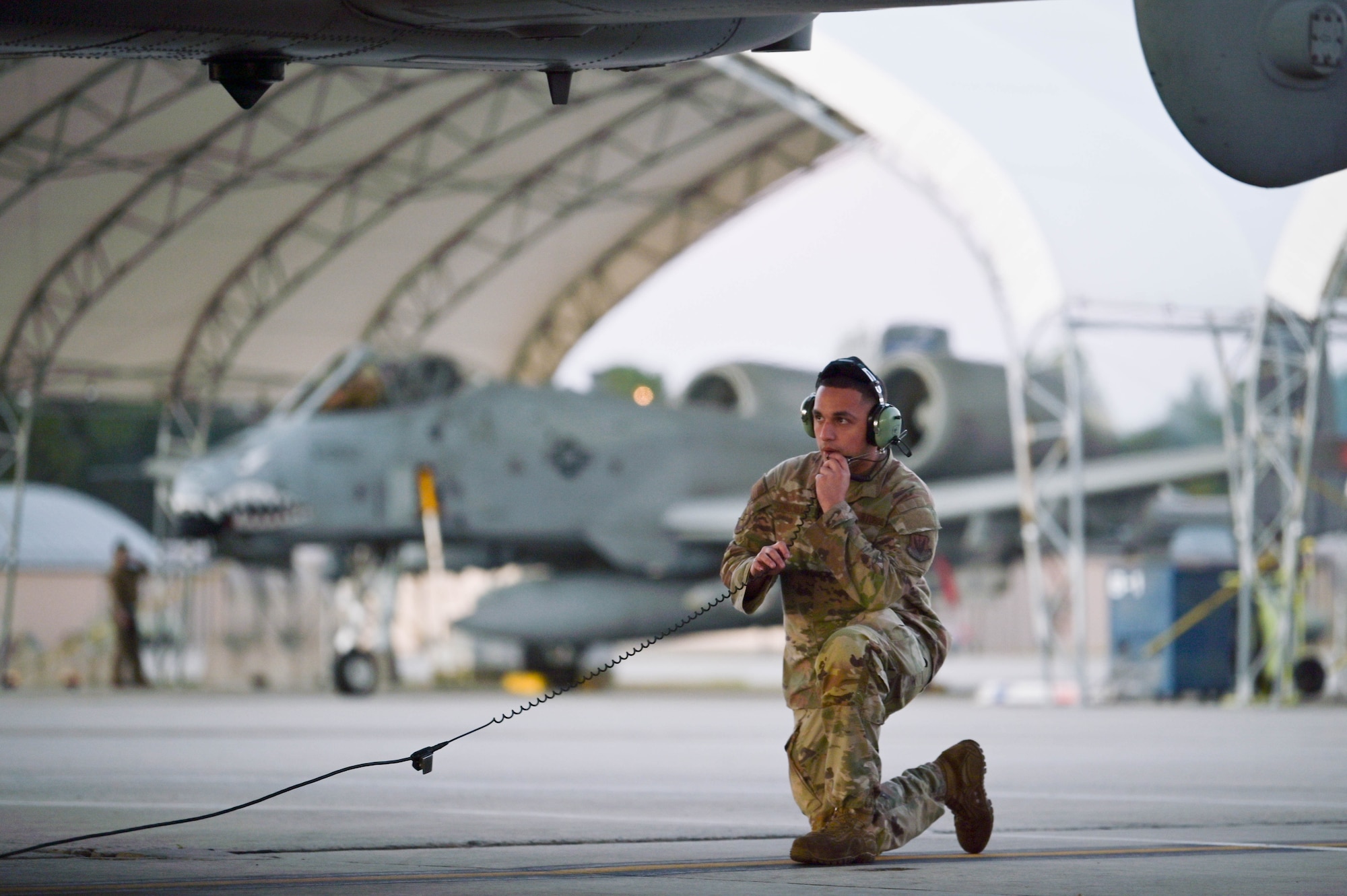 U.S. Air Force Senior Airman Favian Trujillo,74th Fighter Generation Squadron crew chief, helps prepare an A-10C Thunderbolt II for departure at Moody Air Force Base, Georgia, Oct. 16, 2022. The 23rd Wing deployed A-10C Thunderbolt II aircraft and support personnel to Andersen Air Force Base, Guam for a routine Dynamic Force Employment Operation. (U.S. Air Force photo by Senior Airman Rebeckah Medeiros)