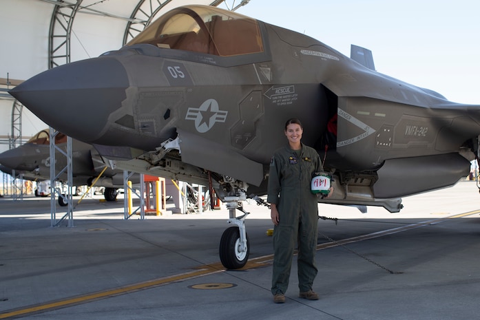 U.S. Marine Corps Sgt. Brooke Thompson, an avionics technician with Marine Fighter Attack Squadron (VMFA) 242, poses for a photo in front of an F-35B Lightning II aircraft at Marine Corps Air Station, Iwakuni, Japan, Oct. 20,2022. Thompson was awarded the U.S. Navy and Marine Corps Commendation medal for her meritorious service since her arrival to MCAS Iwakuni  in 2018, where she held multiple billets, and supported multiple exercises and operations across the Indo-Pacific.